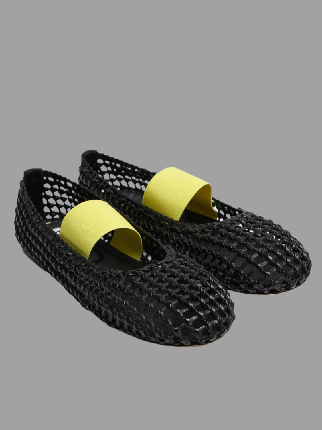 MSGM Leather Mesh Ballerinas in black with contrasting yellow strap; stylish, breathable design made of 100% leather.