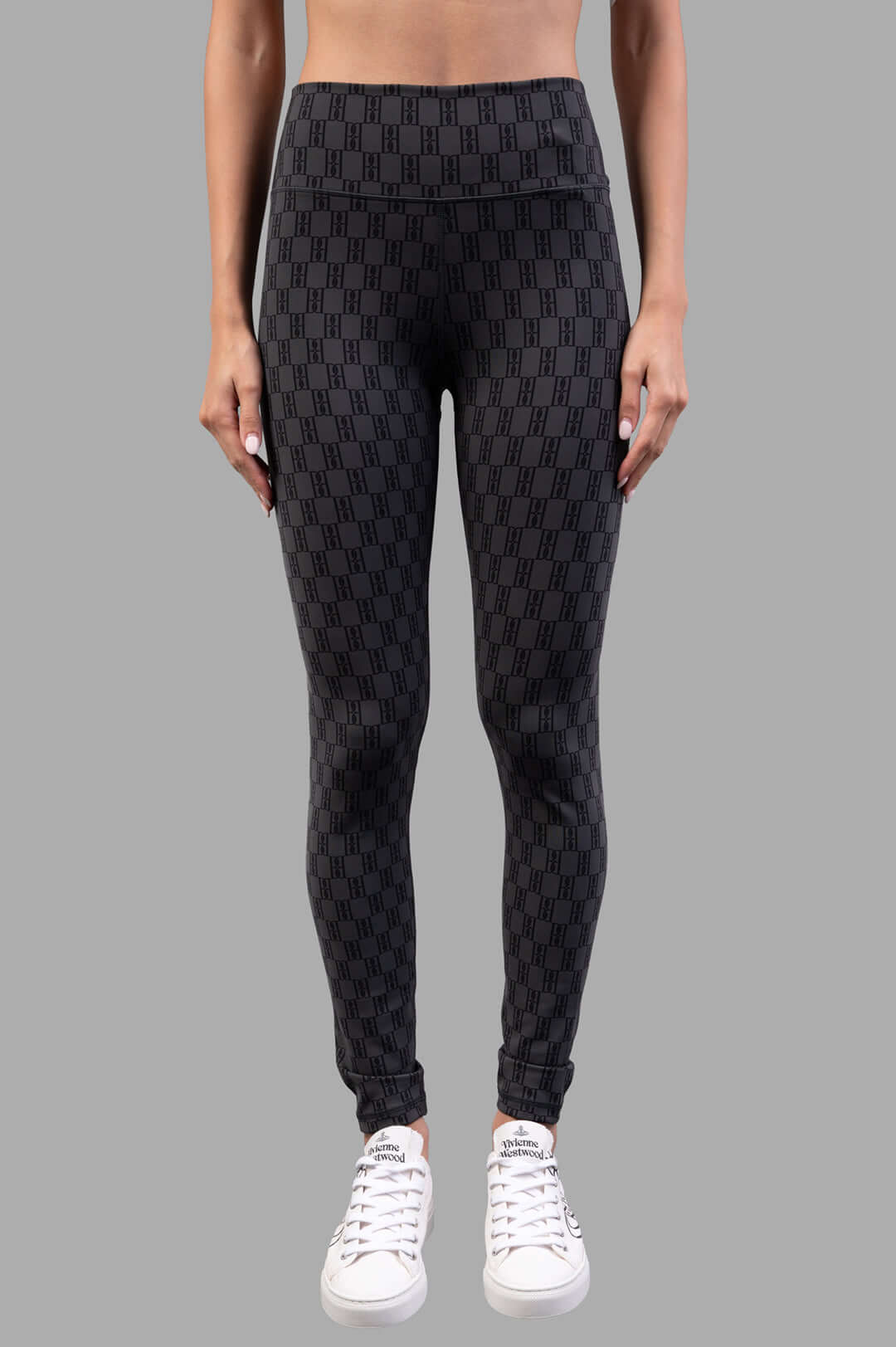 By Malene Birger Polene Athletic Leggings in black & grey, featuring a wide elastic band and monogram design, front view on.