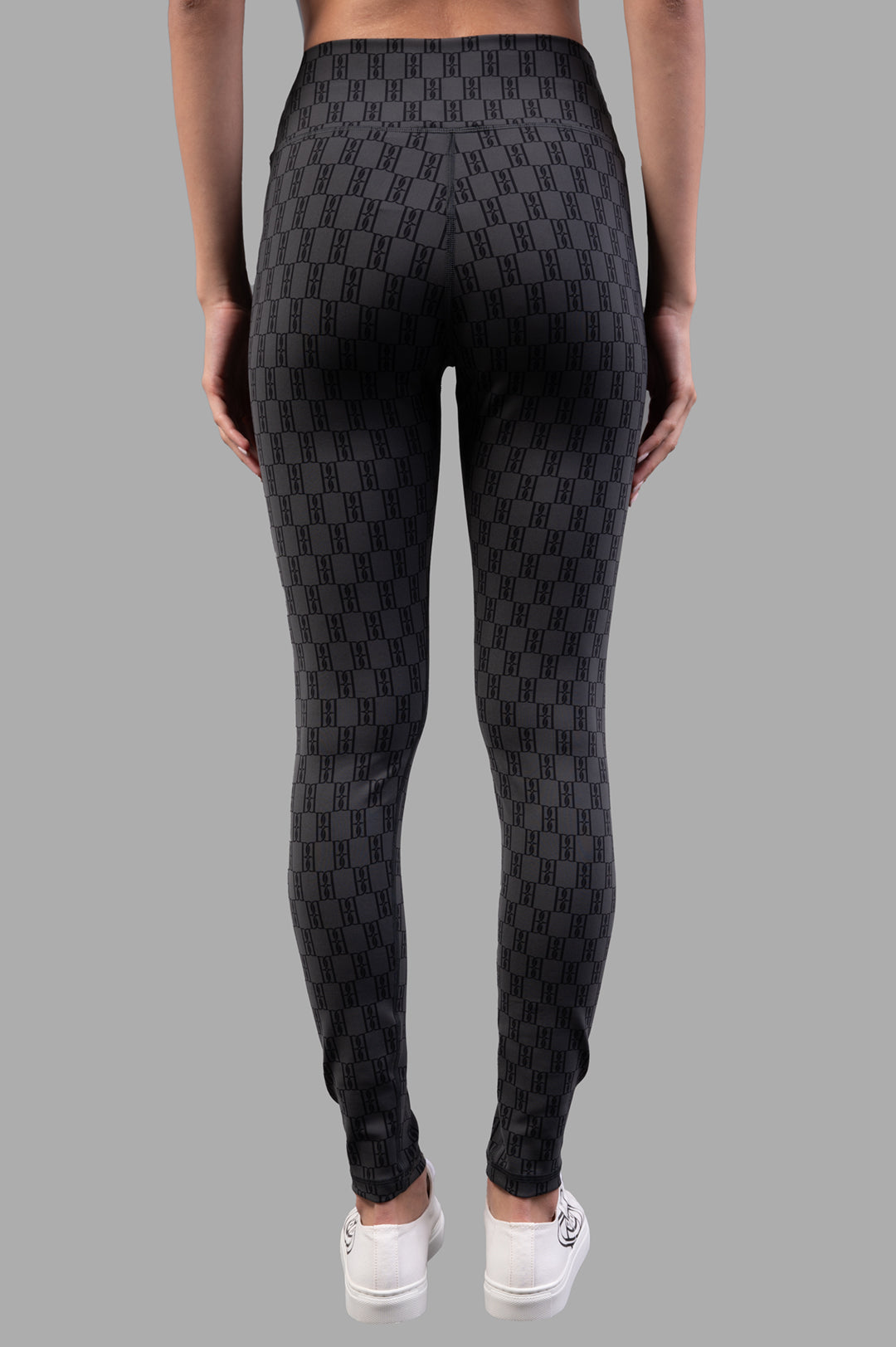 By Malene Birger Polene Athletic Leggings, black & grey, backside view highlighting logo detail and elastic waistband for.