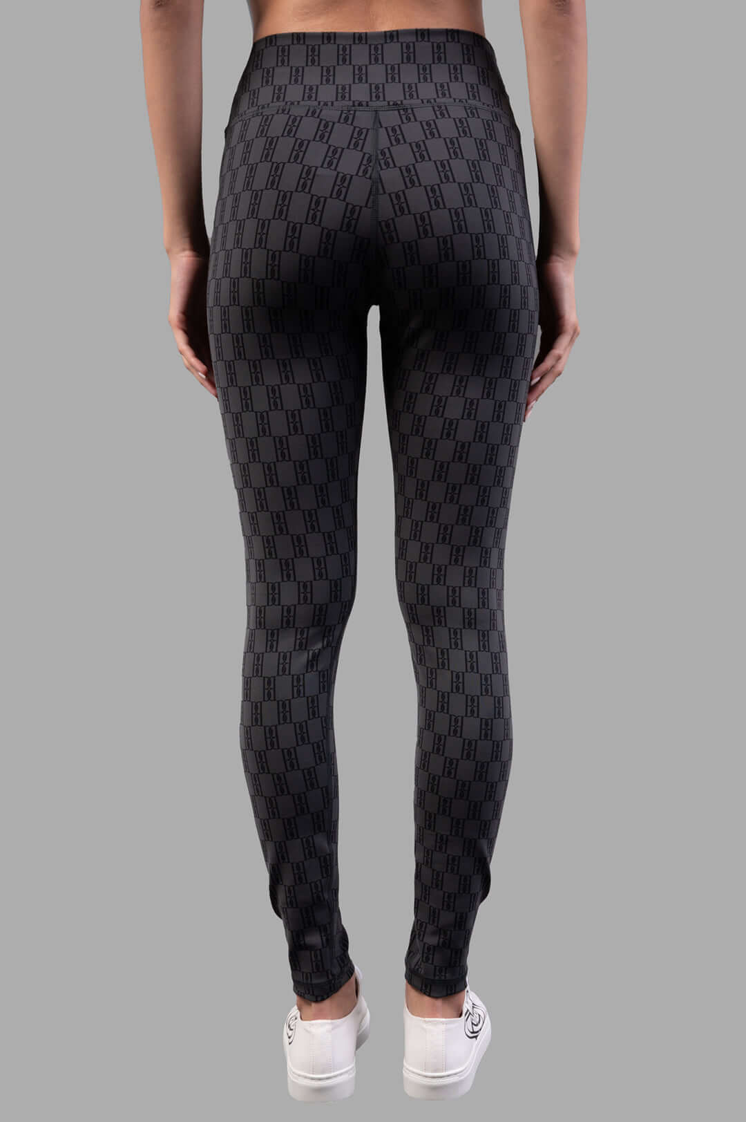 By Malene Birger Polene Athletic Leggings, black & grey, backside view highlighting logo detail and elastic waistband for.