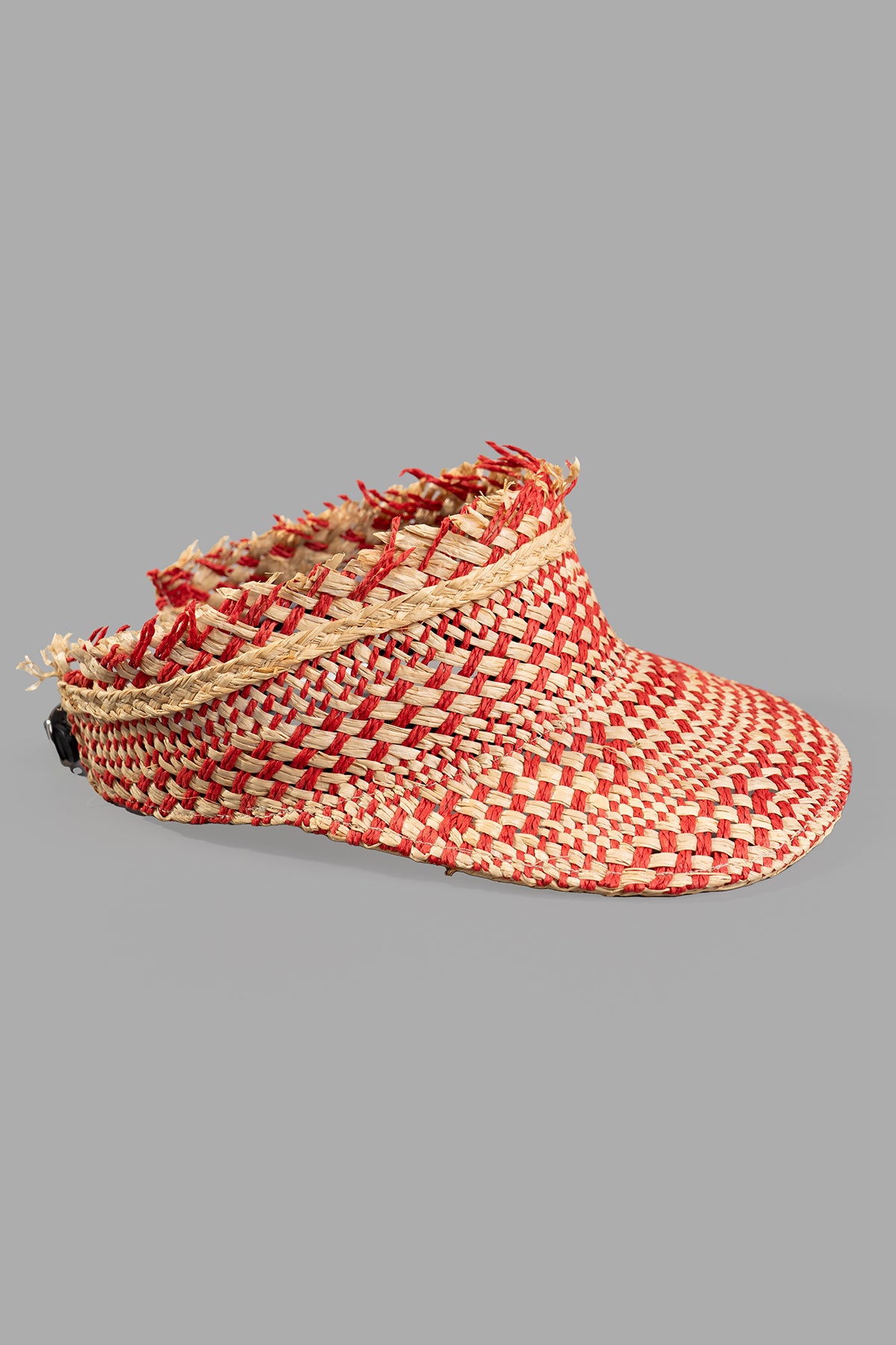 Kijima Takayuki Straw Sun Visor, side view. Beige/red raffia with an adjustable leather strap, showcasing elegant weave.