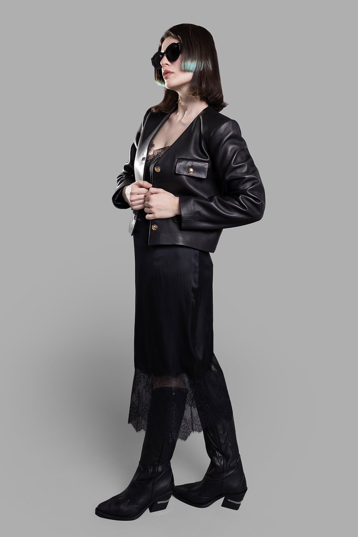 Anine Bing Cara Collarless Jacket shown in side view on-model, featuring front details with buttons and sleek design.