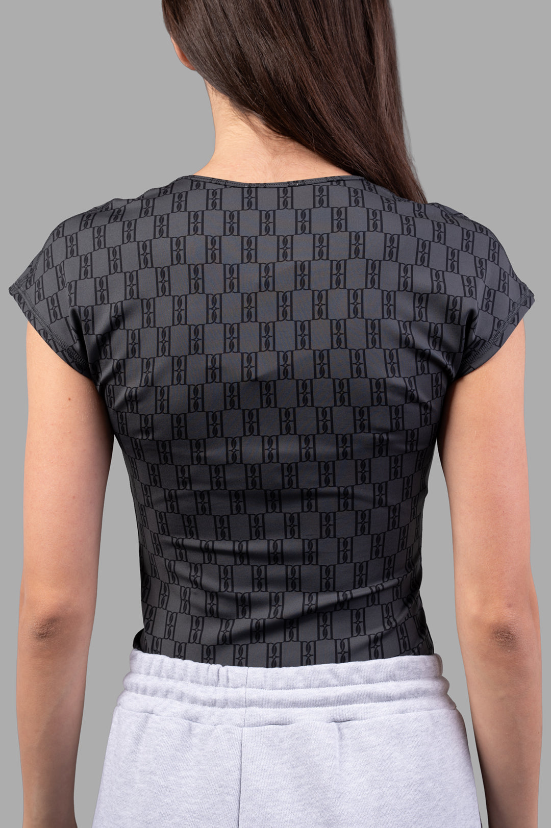 By Malene Birger Venazia Athletic Top, showcasing the back design with a sleek black & grey pattern on soft, stretchy fabric.