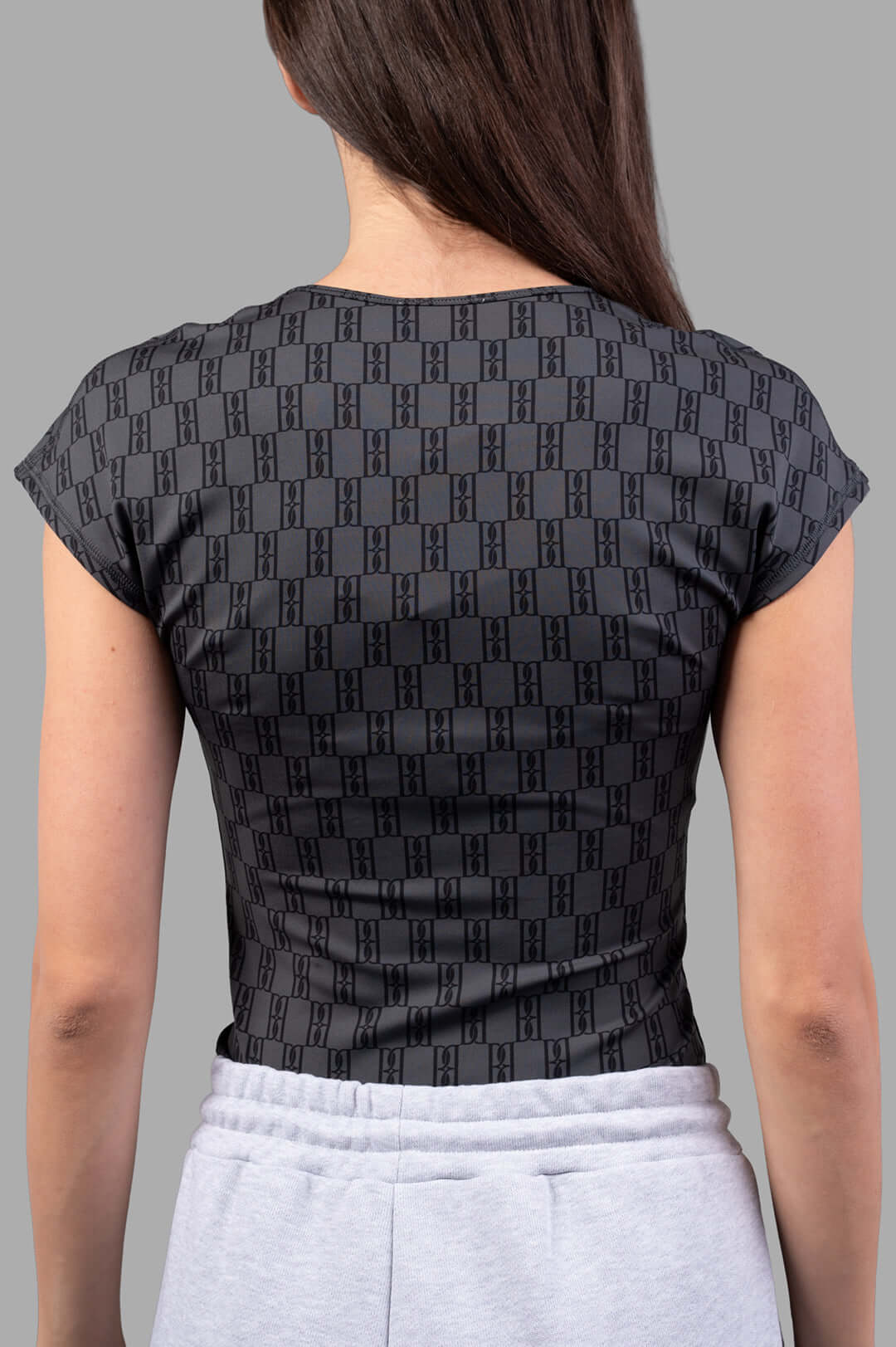 By Malene Birger Venazia Athletic Top, showcasing the back design with a sleek black & grey pattern on soft, stretchy fabric.