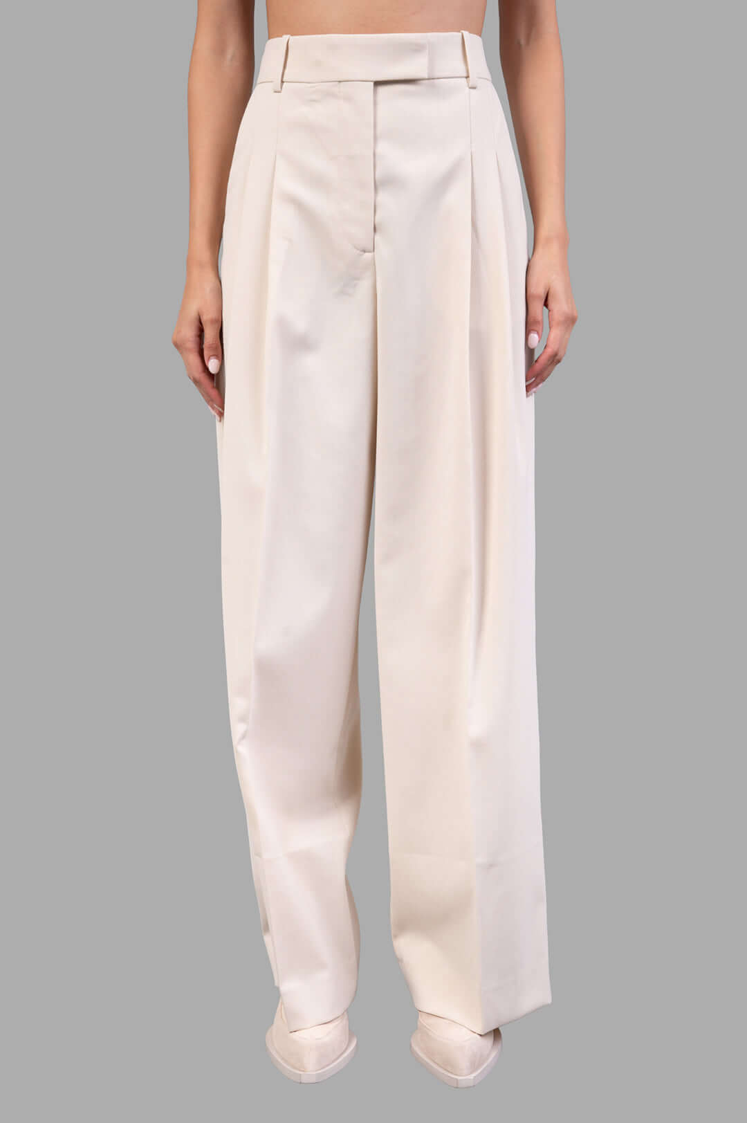 By Malene Birger Cymbaria High-waist Trousers in pearl, featuring sharp pleats and wide legs for a stylish, tailored look.