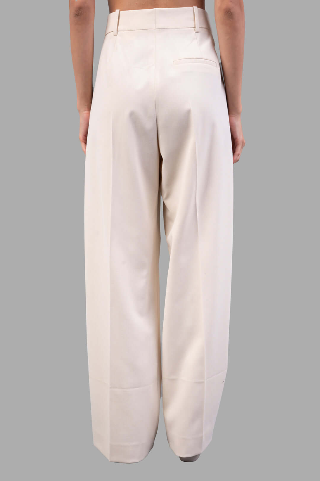 By Malene Birger Cymbaria High-waist Trousers in Pearl, showcasing pleats and wide legs from the back view.