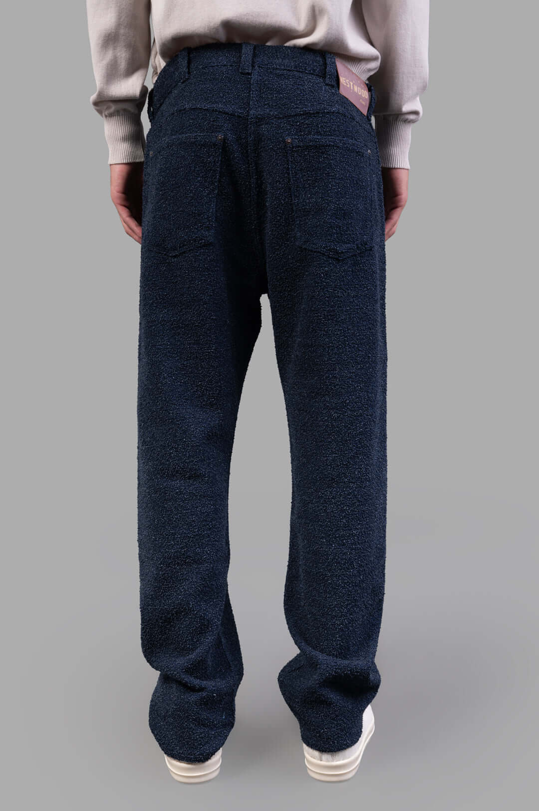 Vivienne Westwood Ranch Bouclé Wool Jeans showcased from the back, featuring textured wool and a branded jacron patch.