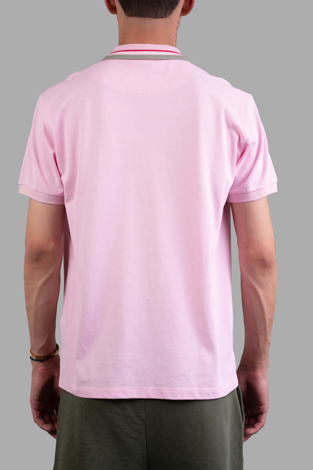 Vivienne Westwood Classic Logo Polo Shirt in pink, featuring a back view with subtle striped detailing and a comfortable fit.