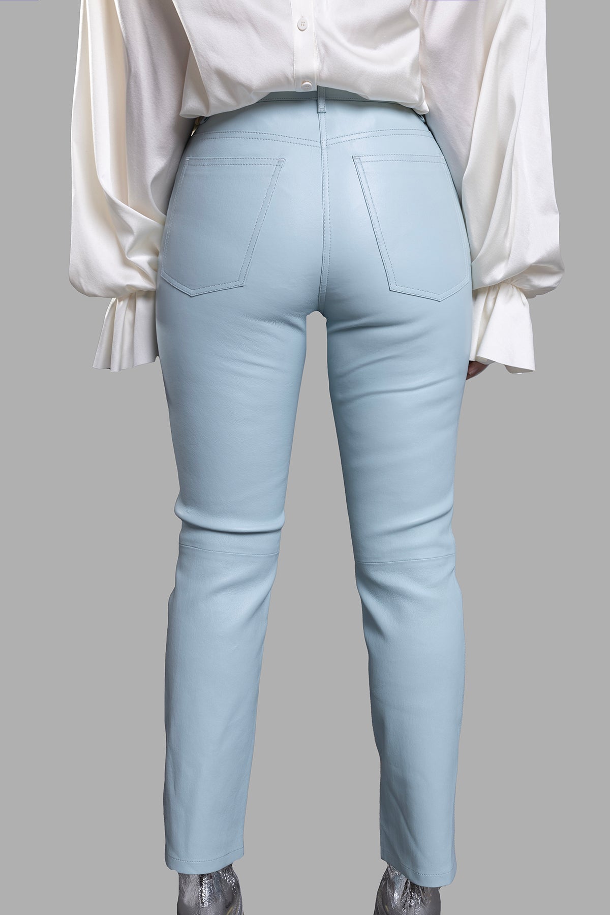 Joseph Straight-leg Leather Trousers showcased from the back, featuring pastel blue leather and classic five-pocket design.