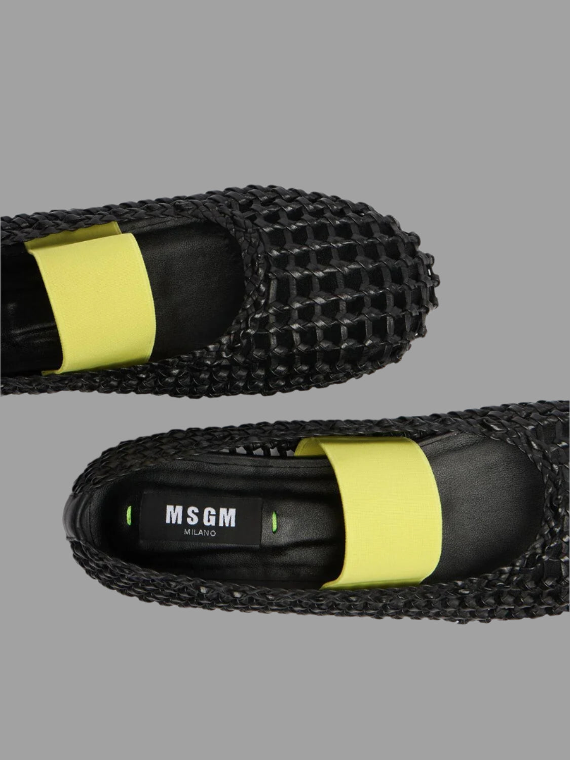 MSGM Leather Mesh Ballerinas featuring a black leather upper with a contrasting yellow elastic strap, top view detail.