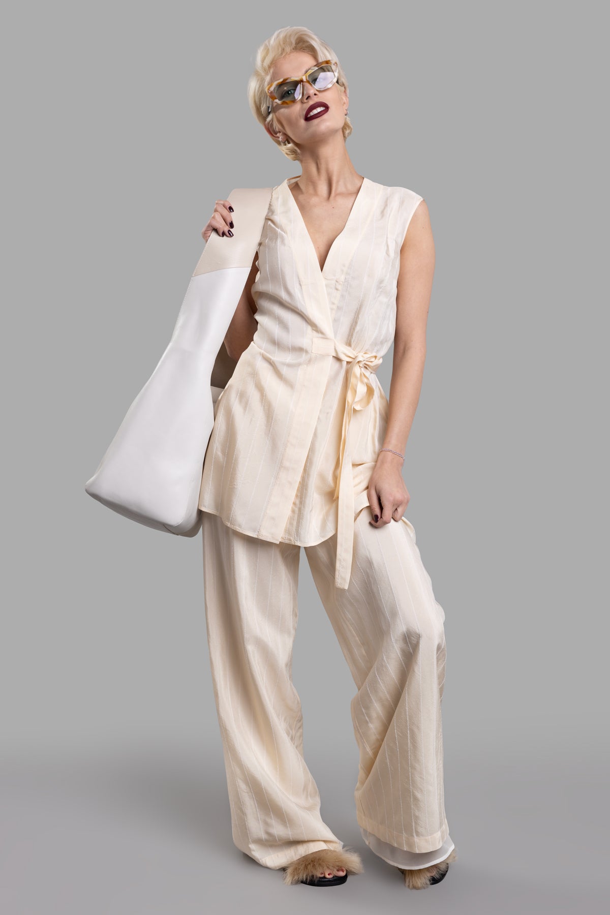 Gentry Portofino Wrap-me-up Top, ecru, V-neck, side bow, hip-length, on-model, viscose-cotton blend, front view.