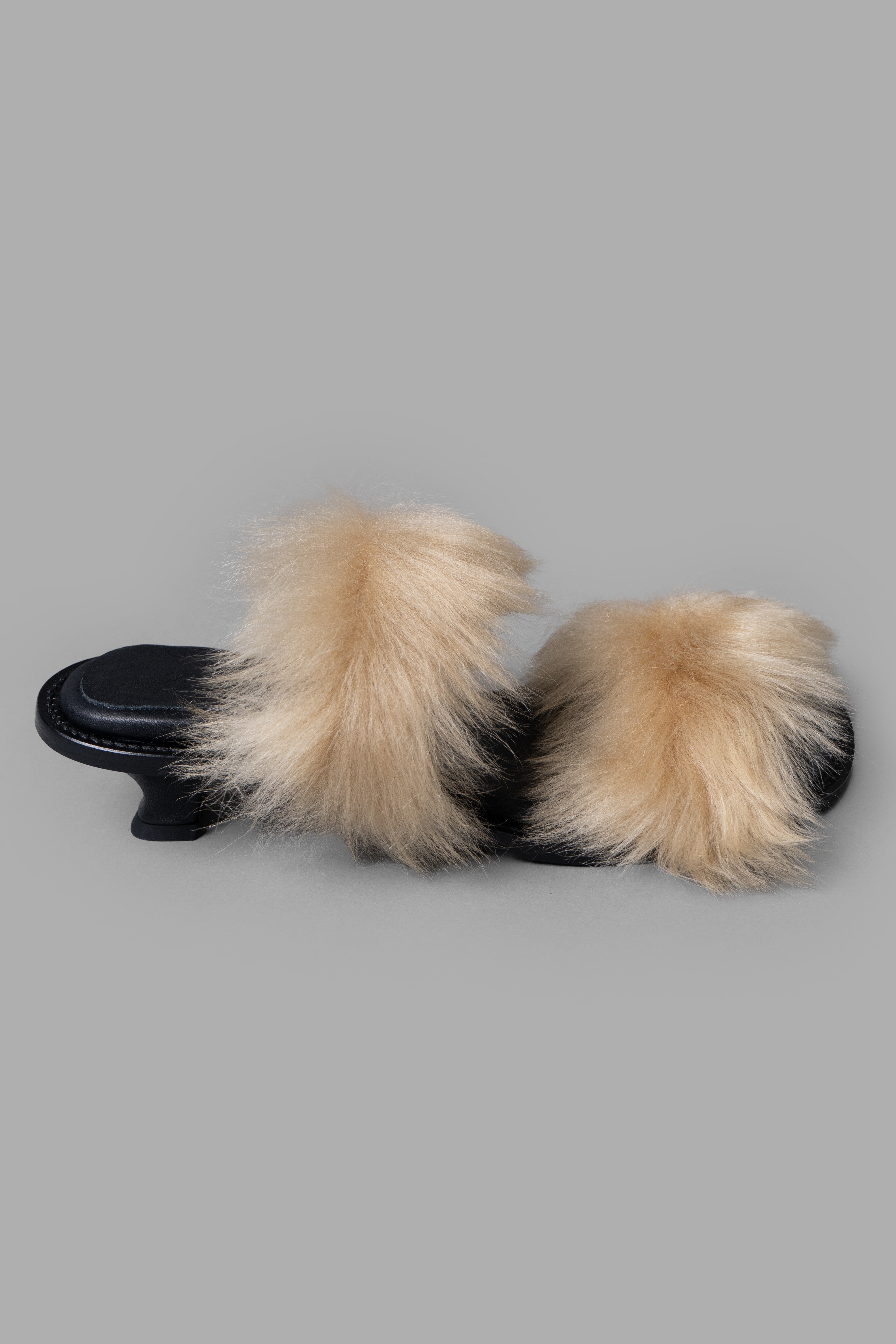 By Malene Birger Tianna Sandals, front view, showcasing black leather and beige shearling on low Cuban heels.
