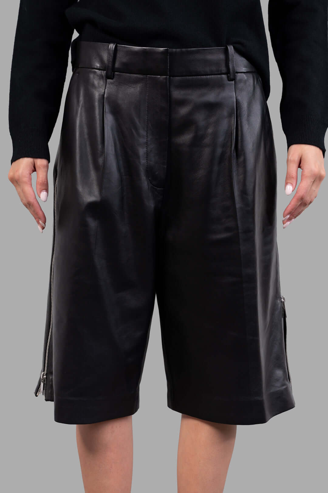 Helmut Lang Leather Zoot Shorts in black, showcasing wide-leg design and metal zippers on adjustable side slits.