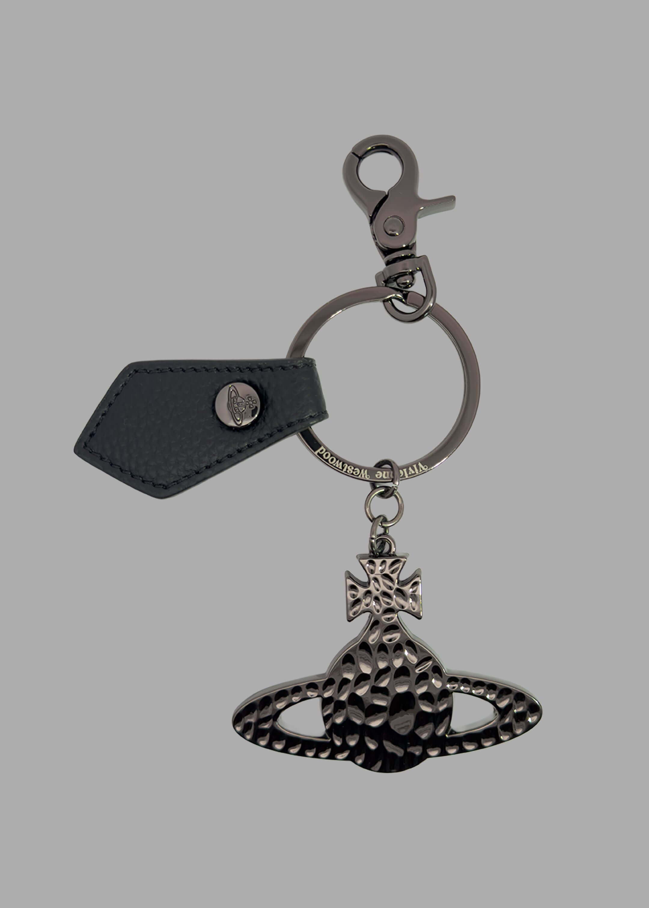 Vivienne Westwood Hammered Orb Keyring with black saffiano leather tab and engraved metal ring, front view.