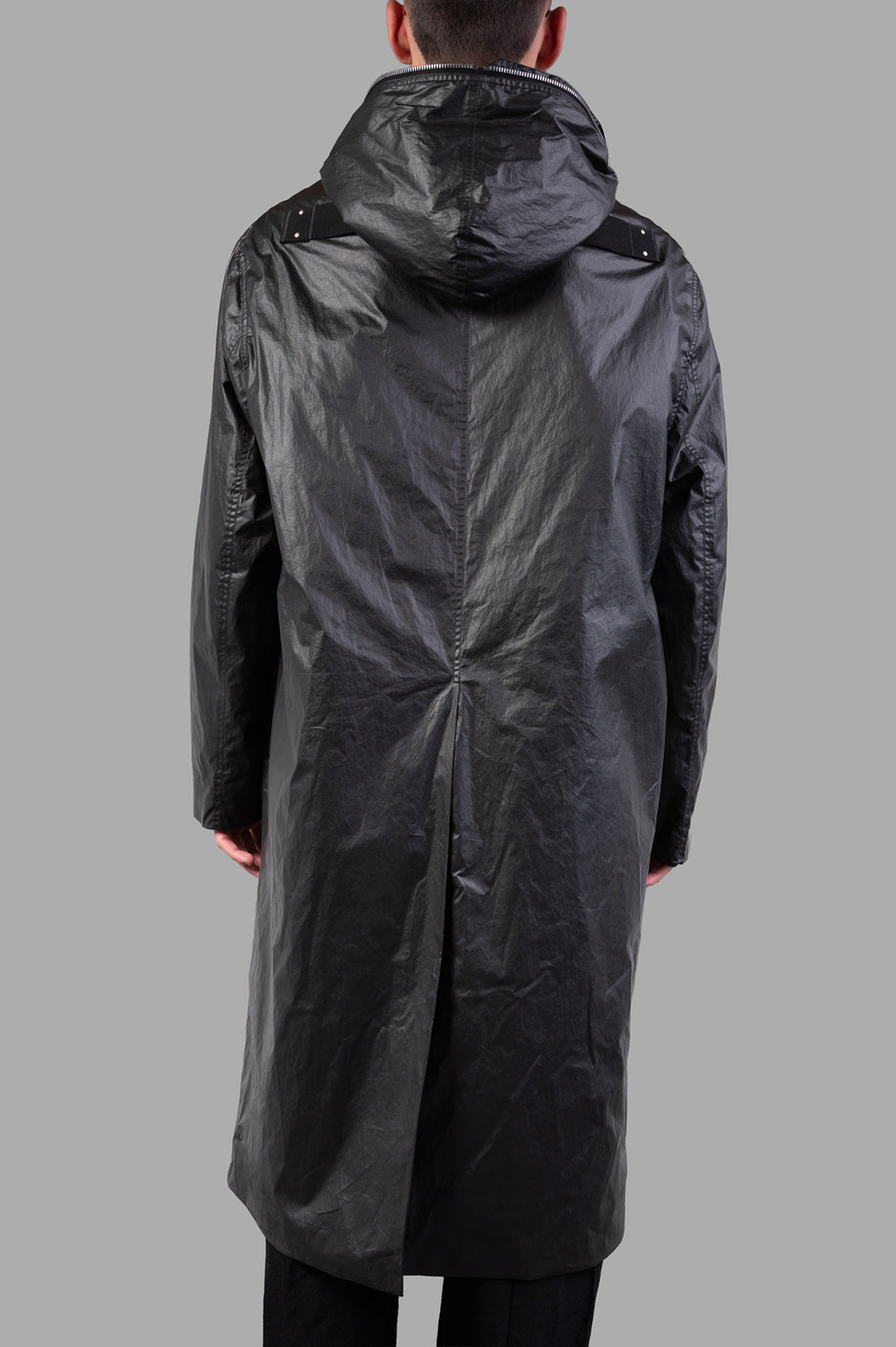 Rick Owens Concordians Gimp Mac in Black, showcasing the back view with a large hood and unique strap detail.