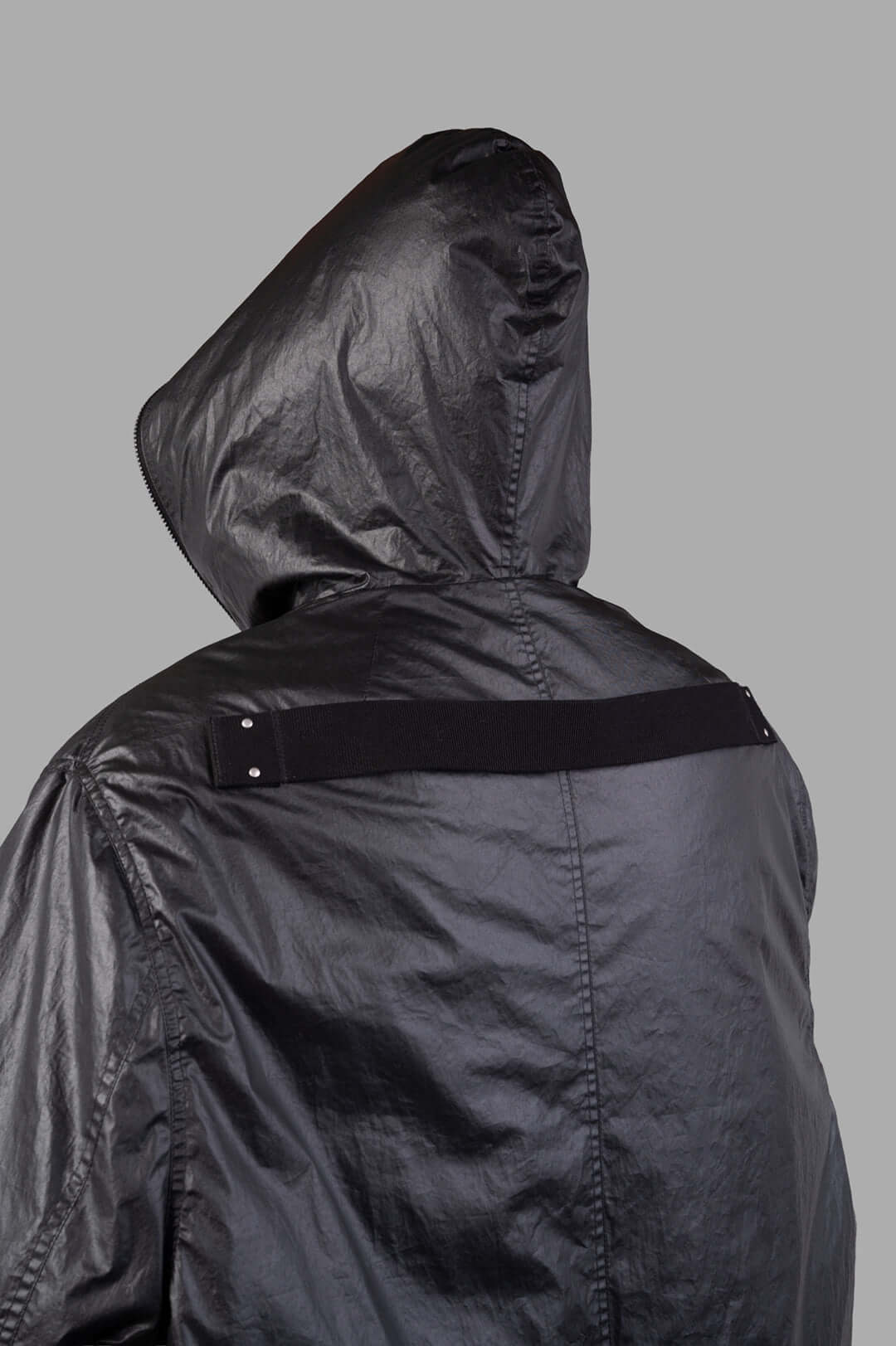 Rick Owens Concordians Gimp Mac in Black, showcasing a large hood and unique back strap detail. Stylish below-knee length.