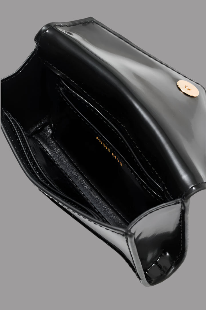 Anine Bing Elly Wallet interior view showcasing smooth black leather, card slots, and gold logo detailing.