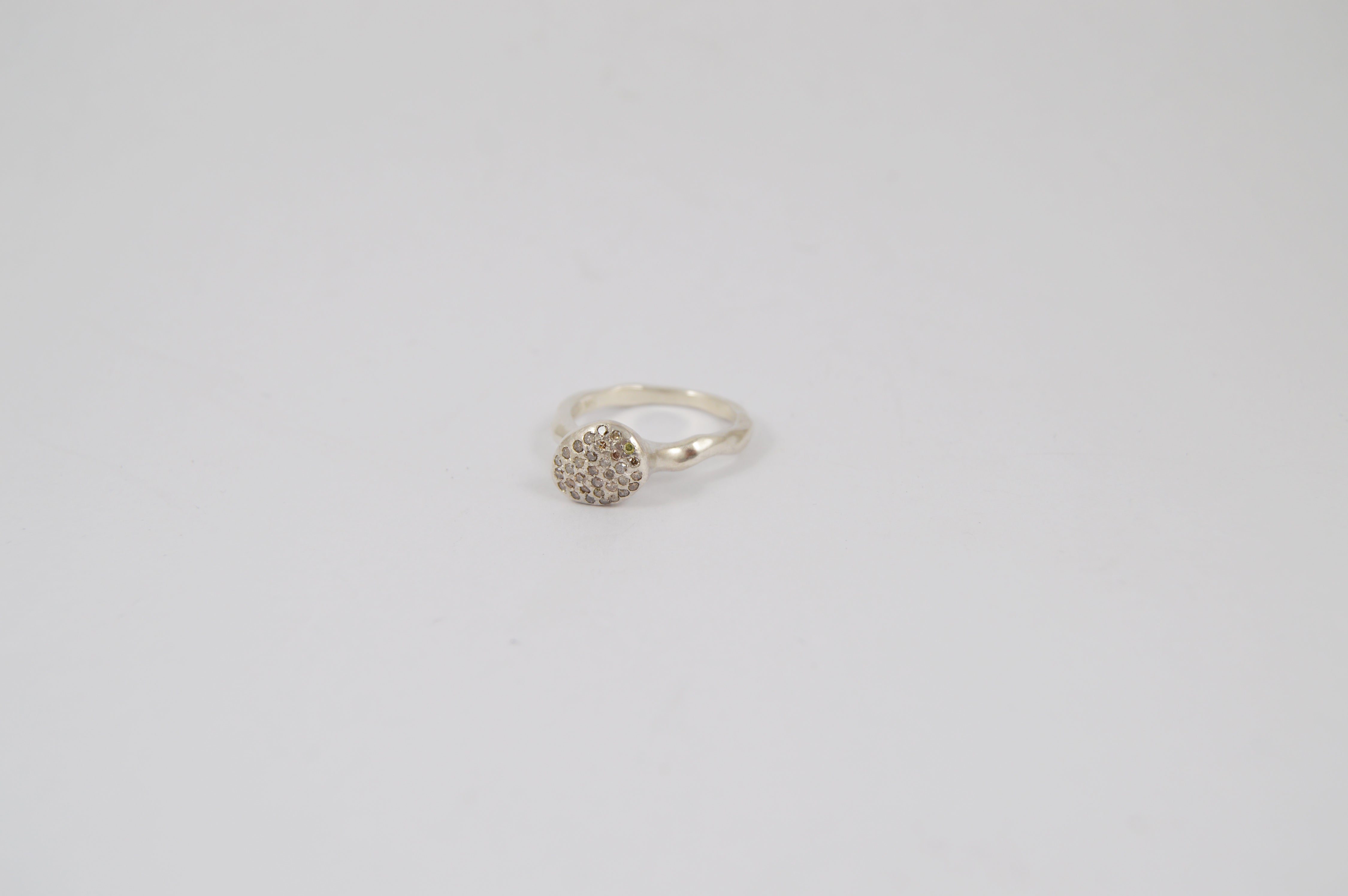 Rosa Maria Pavé Diamond Asymmetric Ring in sterling silver with icy diamonds, side view showing organic shape on white.