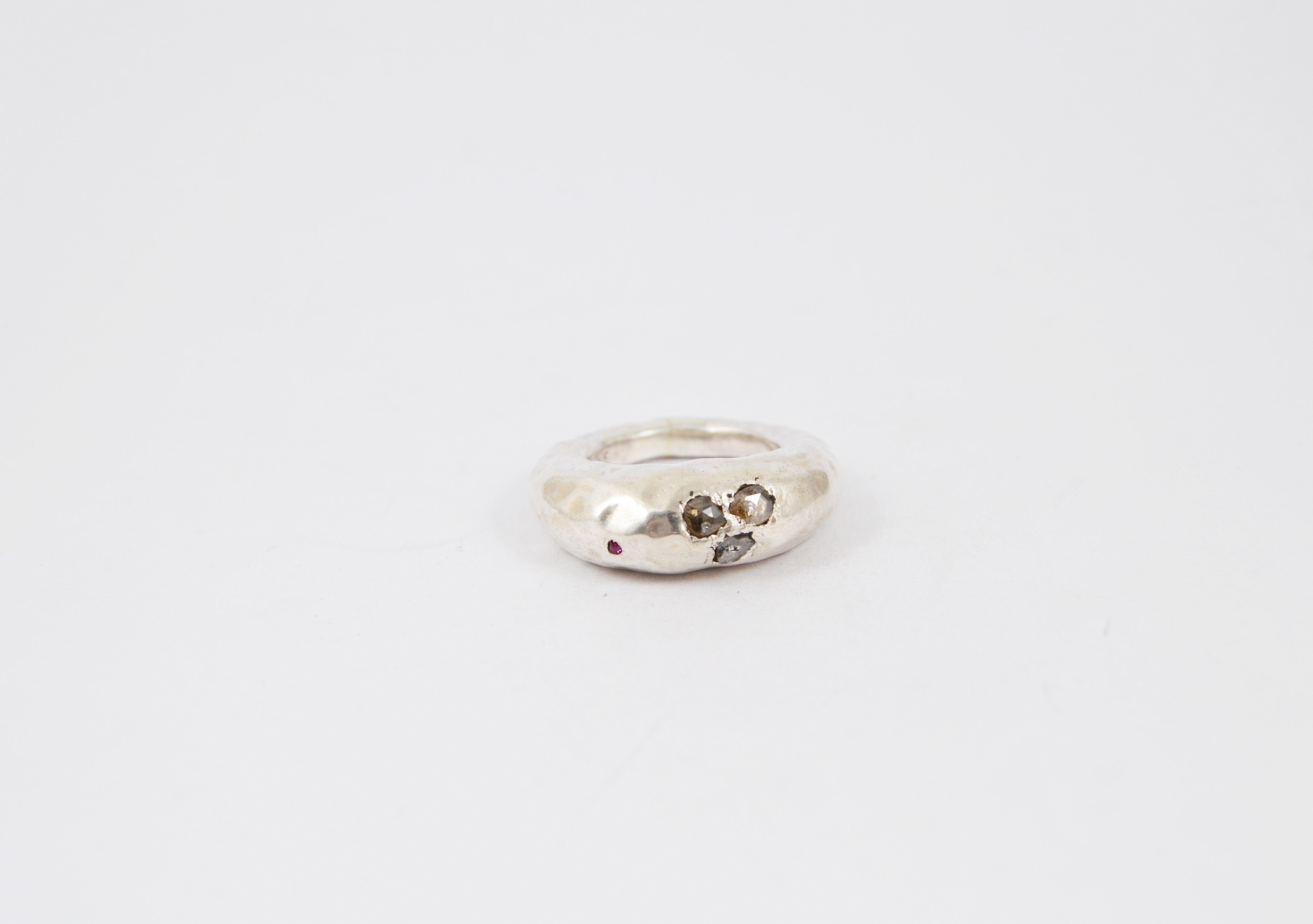 Rosa Maria Brandy Ring, front view showcasing textured silver band with embedded gemstones.