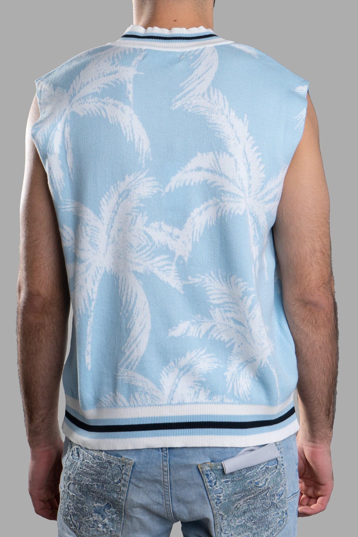 Gaëlle Paris Knit Vest in blue with palm print, featuring a sleeveless design and ribbed hem, shown from the back.