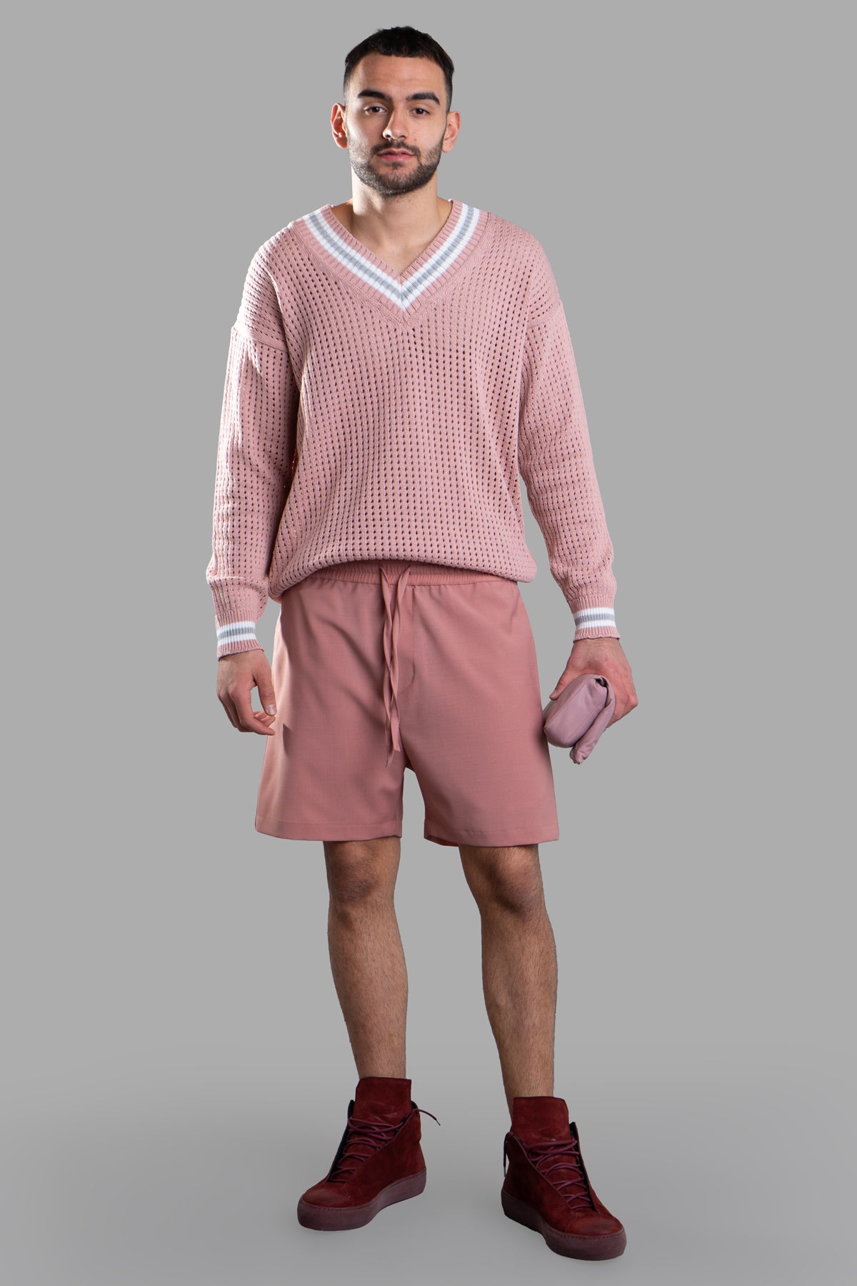 Gaëlle Paris Pink Bermuda Shorts on-model, featuring elastic waistband and drawstrings for comfort and style.