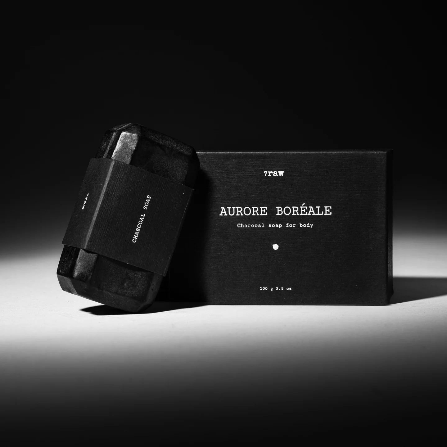 7Raw AURORE BORÉALE Charcoal Soap front view with packaging, showcasing black soap bar and minimalist design.