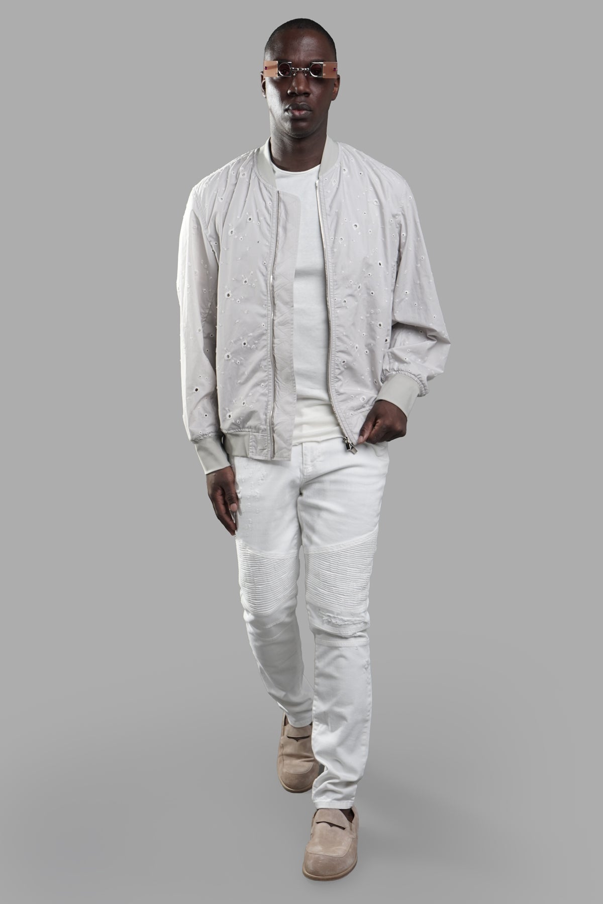 Vein lightweight bomber jacket in light grey cotton shown on model, featuring stylish front view and textured design.