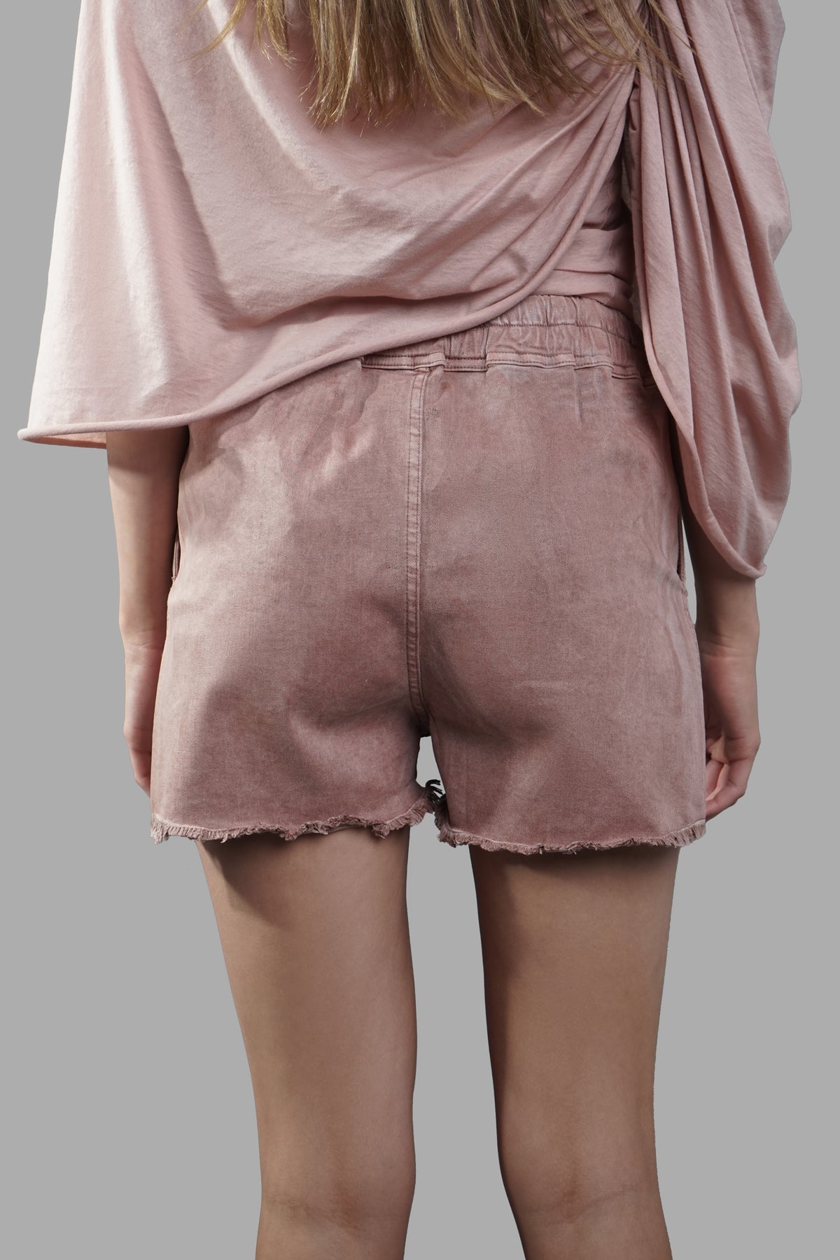 Rick Owens Denim Boxers in dark pink, featuring frayed hem and elastic waistband, showcased from the back on model.