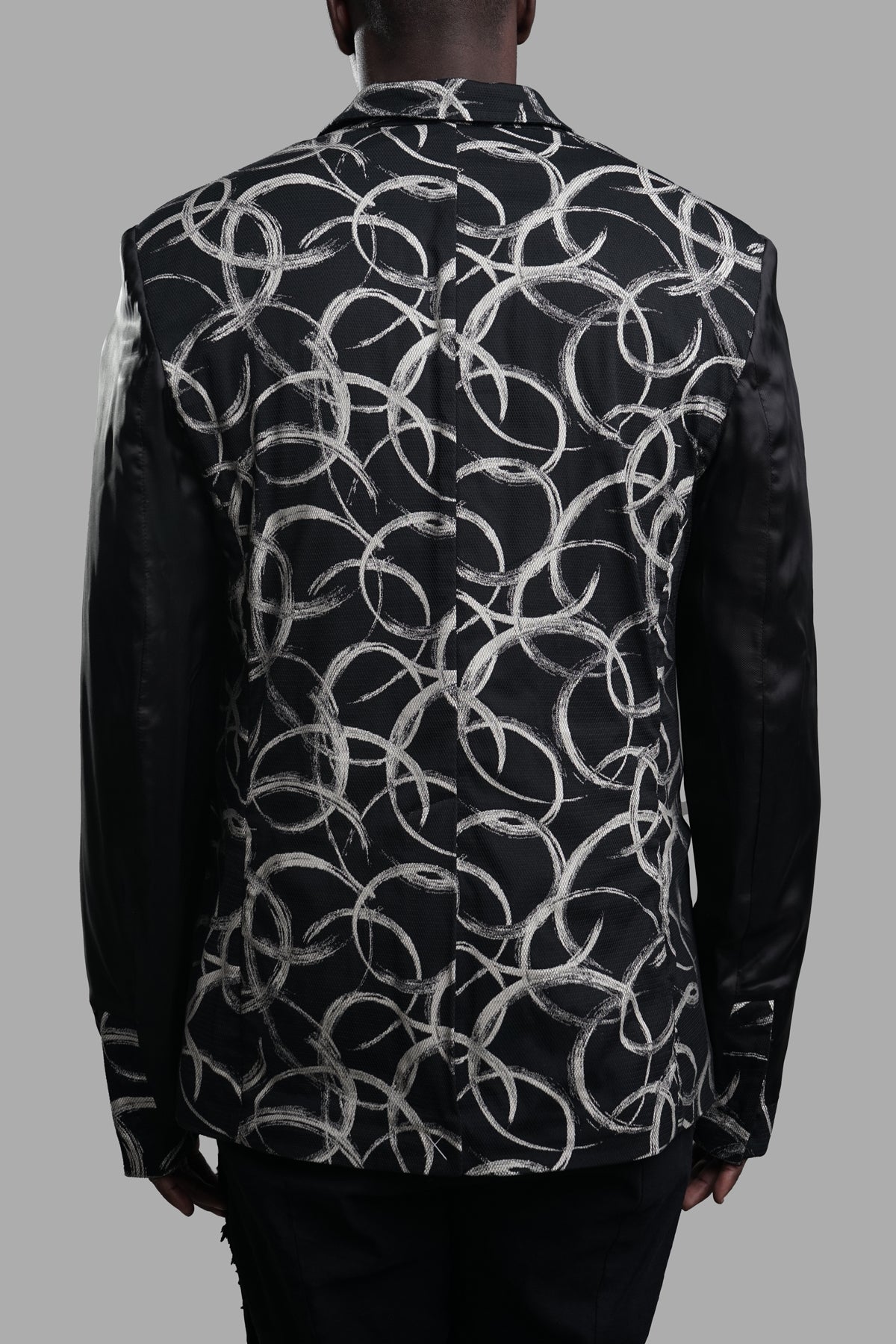 Giovanni Cavagna Graphic-print Blazer showcasing the back design with contrasting black sleeves and bold graphic print.