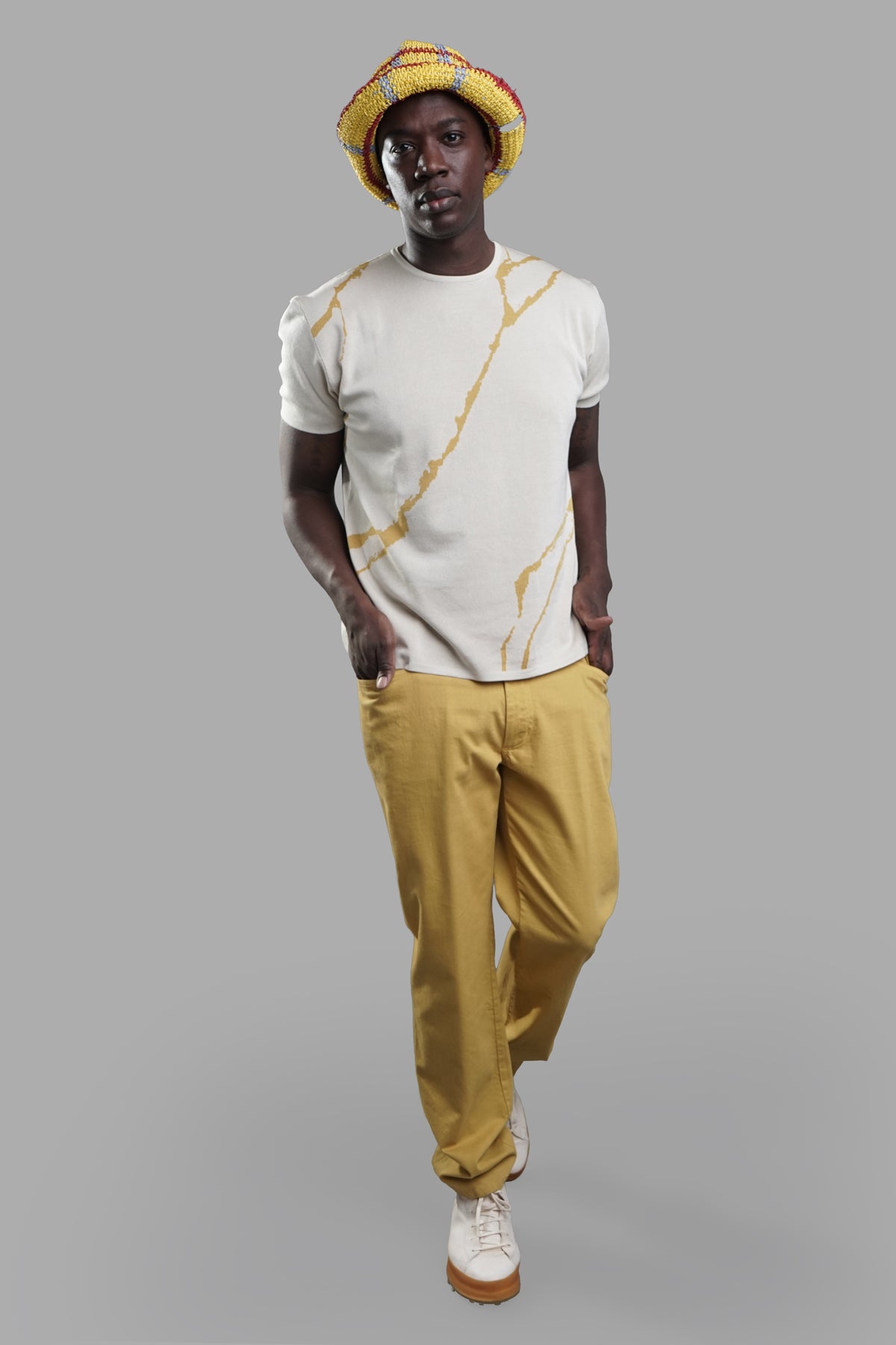 AION Ochre Jeans, front view showcasing relaxed fit with yellow hue, styled with casual t-shirt and shoes.