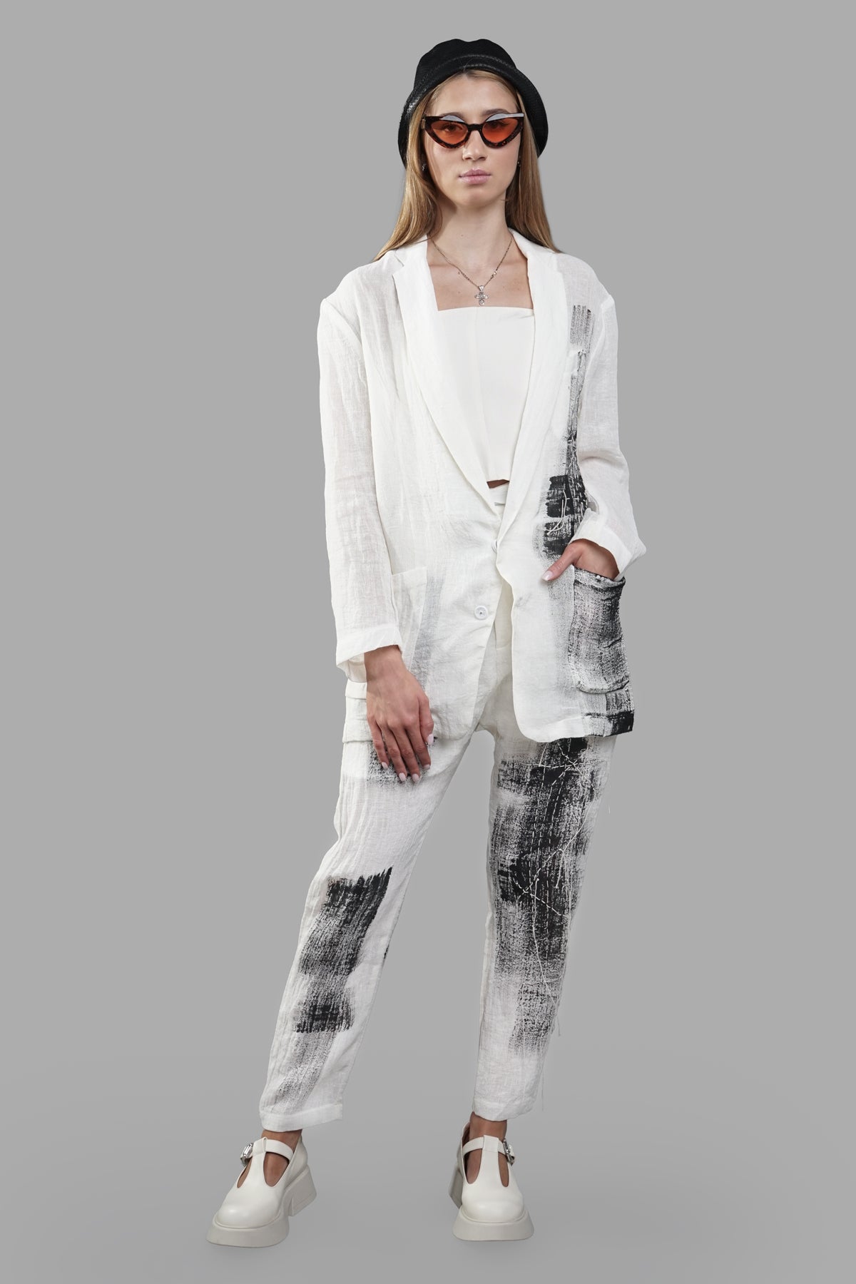 Giovanni Cavagna Painted Blazer on model, side view; black and white abstract print on lightweight linen, single-button.