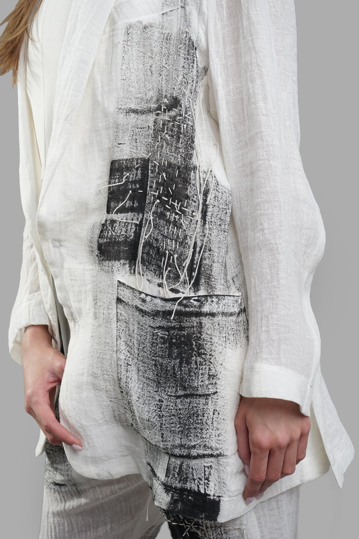 Giovanni Cavagna Painted Blazer showcasing lightweight linen fabric, abstract print detail, and side pockets on model.