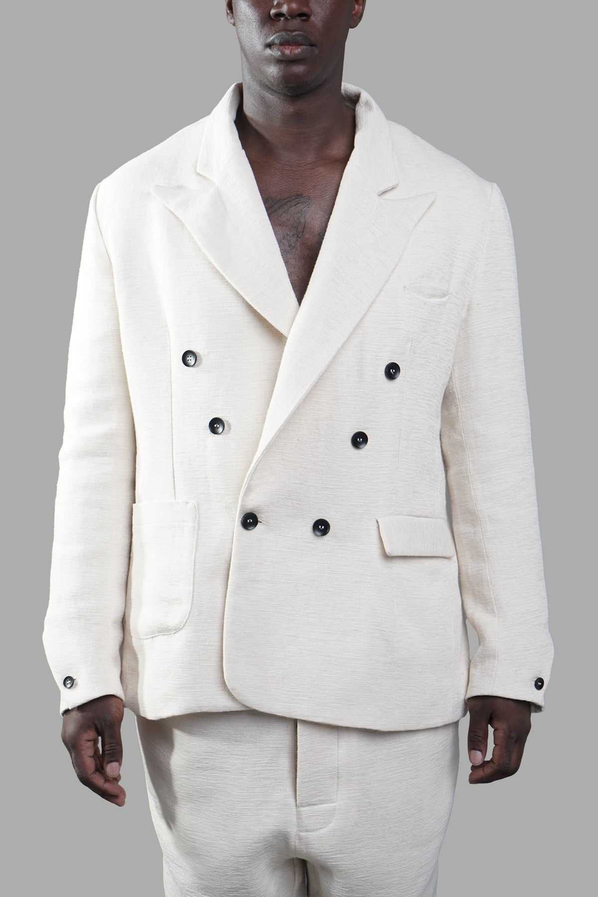 Marc Point Double-breasted Blazer in white, showcasing the front view with wide peaked lapels and button cuffs.