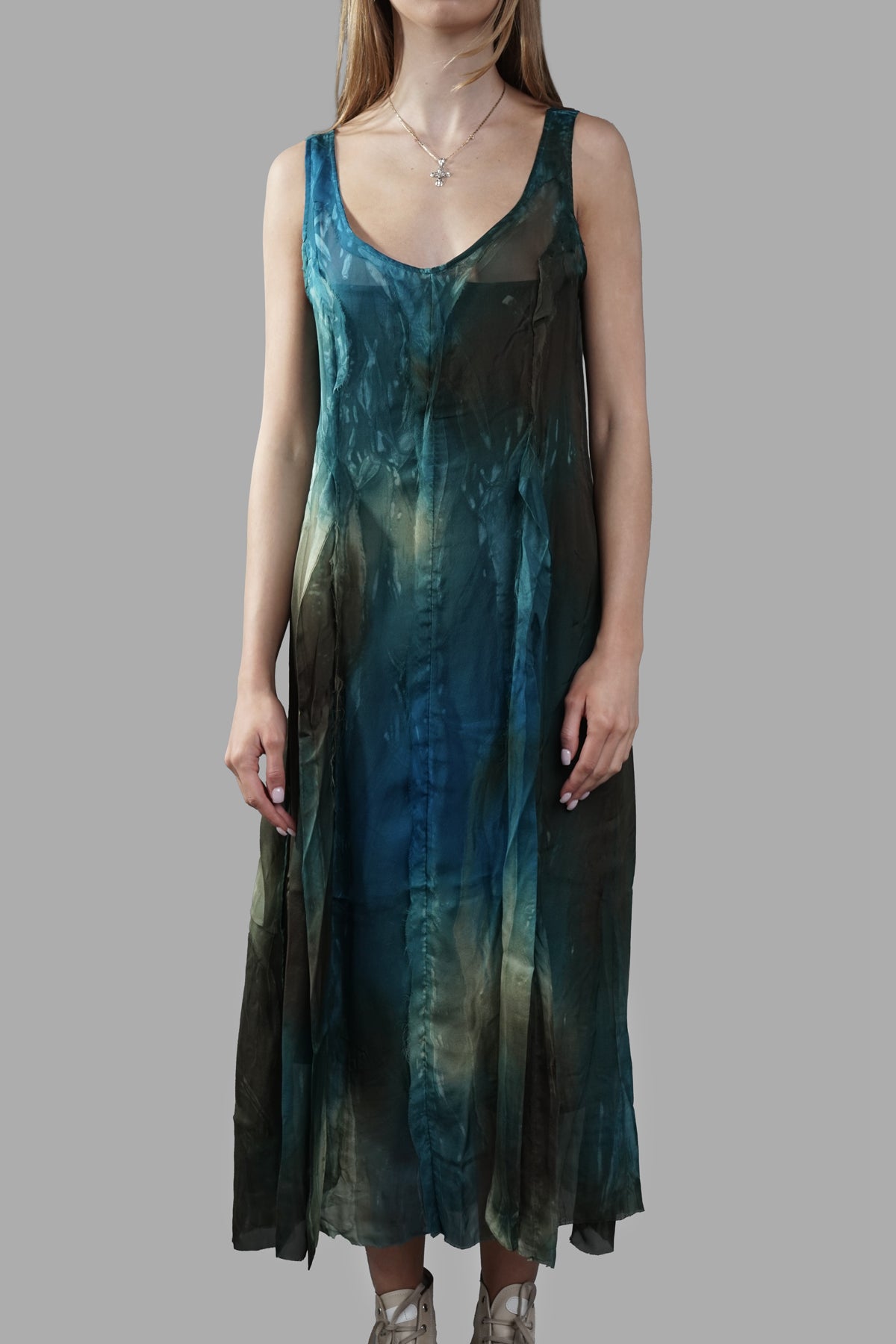 Masnada Abstract-print Dress, front view on-model; sleeveless V-neck midi in blue-green tonal print.