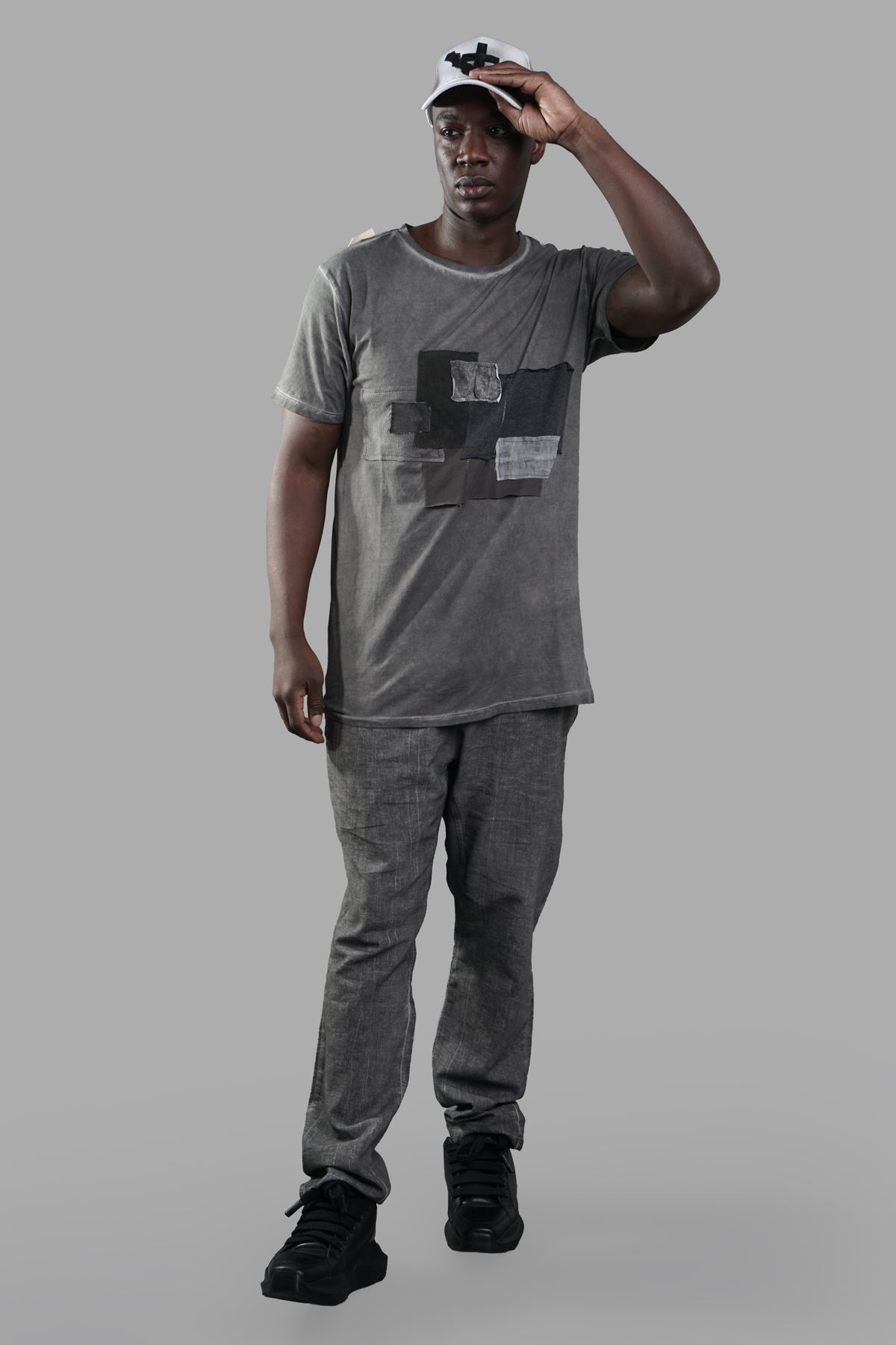 Marc Point Graphic T-shirt in grey, on-model front view, features relaxed fit, round neck, and unique graphic design.