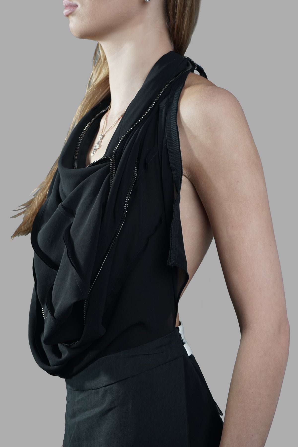 Giovanni Cavagna Open-back Dress showcasing draped front, halterneck, and open back detail on model. Color: Black.