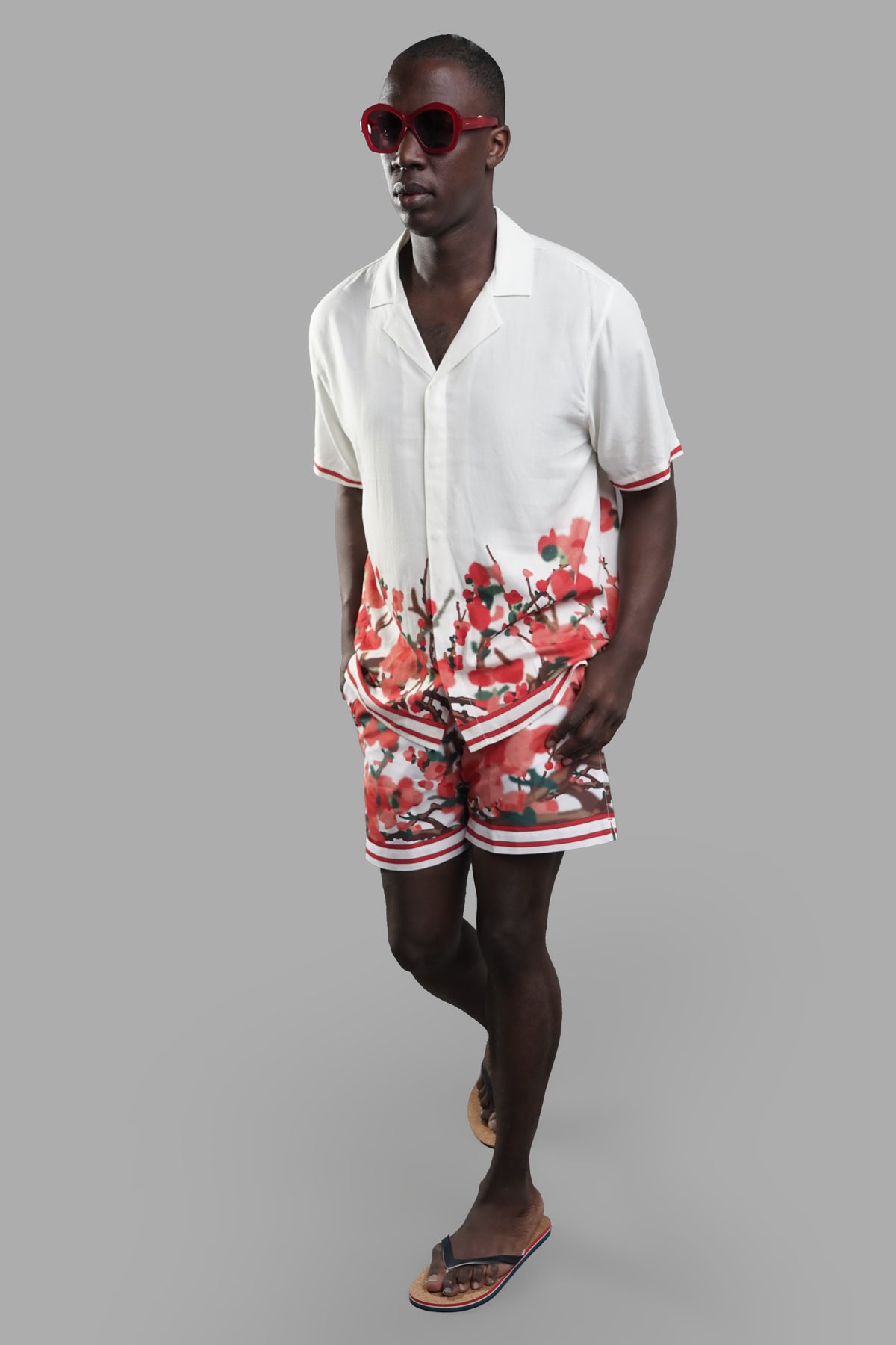 Orlebar Brown Blossom Capri Collar Shirt, front view on-model, showcasing floral pattern and casual summer style.