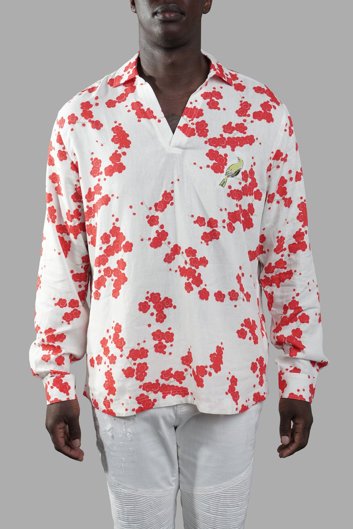 Orlebar Brown Blossom Overhead Shirt, front view with vibrant red floral pattern on a model, detailed stitching showcased.