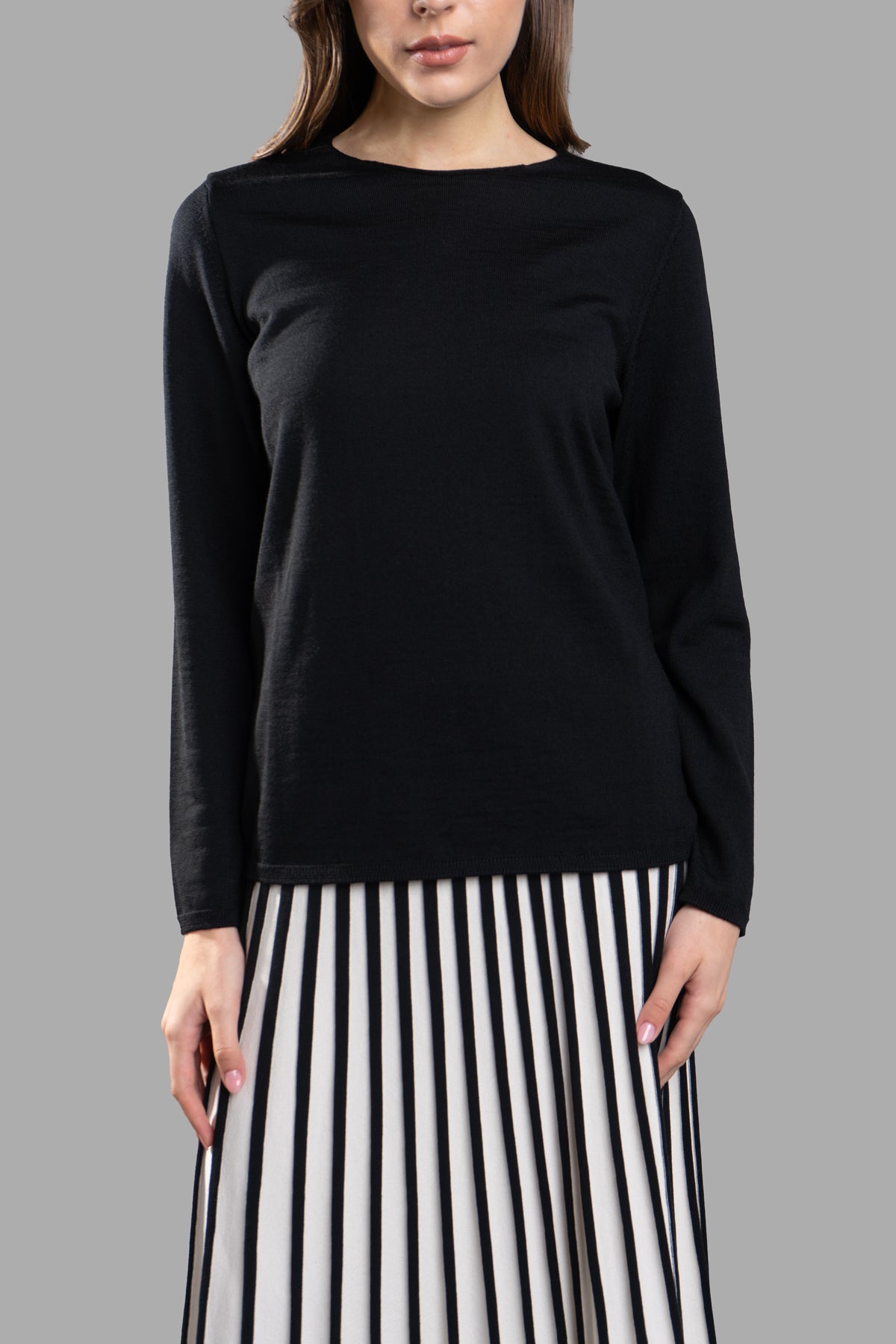 Comme des Garçons Fine-Knit Jumper in black, featuring a classic round-neck design displayed on a model.