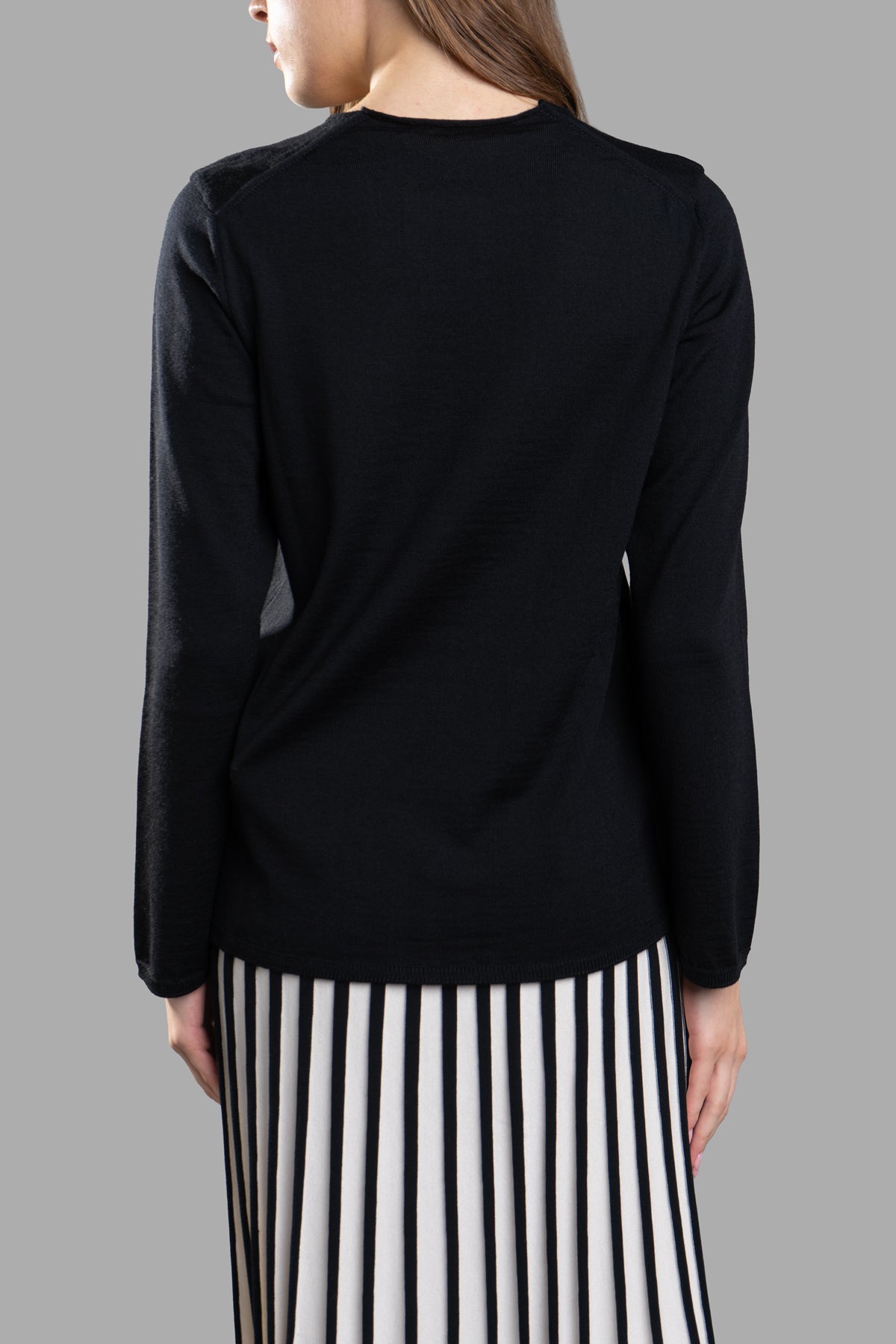 Comme des Garçons Fine-Knit Jumper, black wool, featuring a classic round neck and a sleek back design on model.