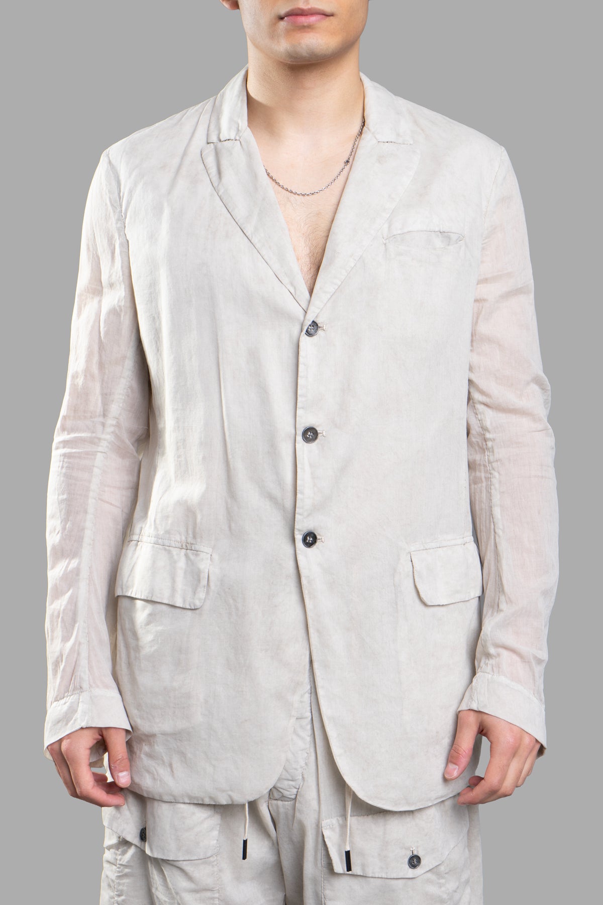 Masnada Moon Lightweight Blazer features side flap pockets, contrasting buttons, and a sleek profile in a refined color.