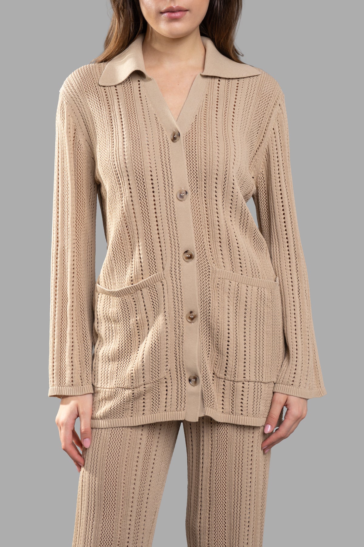 By Malene Birger Open-knit Cardigan in sand beige featuring a button front, collar, and pockets, showcasing detailed texture.