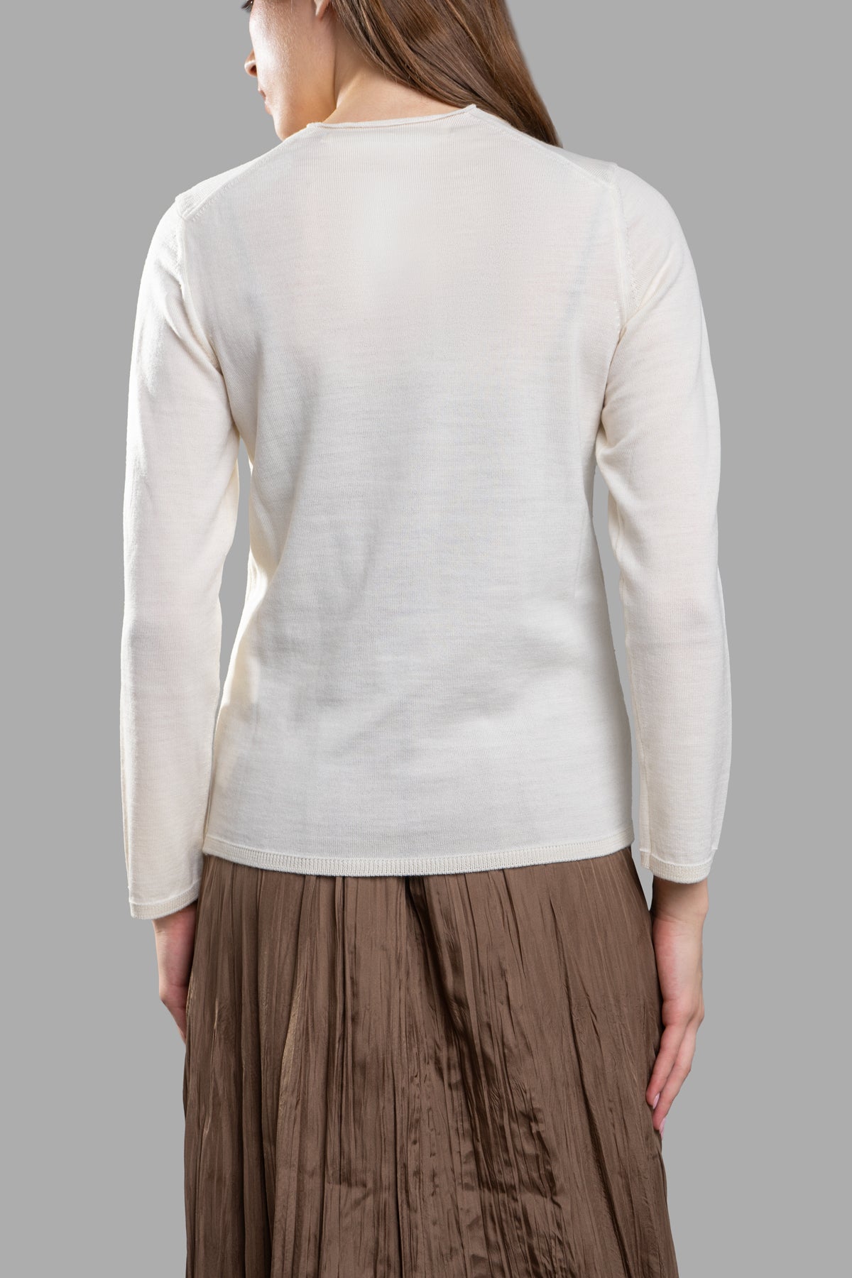 Comme des Garçons Fine-Knit Jumper, ecru wool jumper viewed from the back showcasing its elegant, textured design.