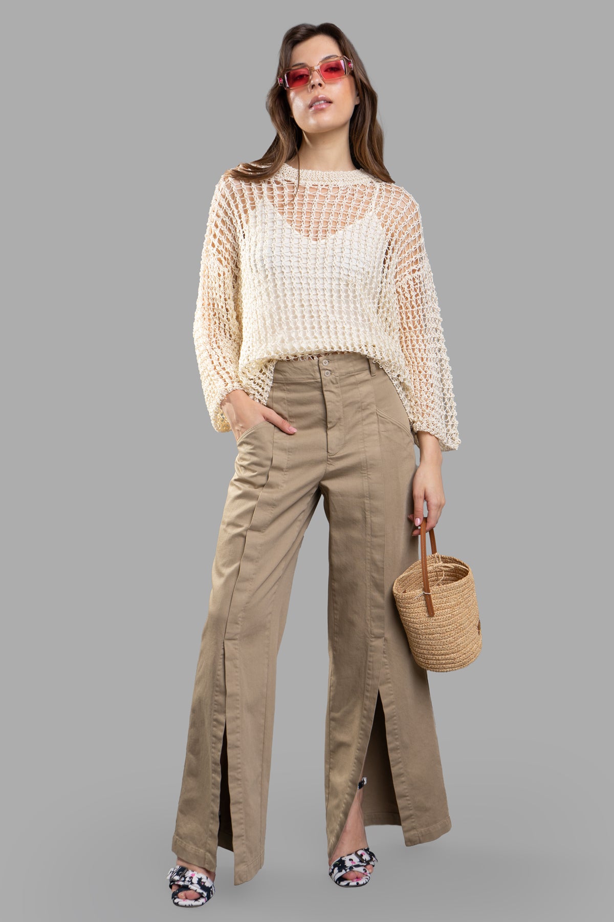 Gentry Portofino Denim Palazzo Pants in beige, featuring front slits and pockets, styled on-model with a woven top.