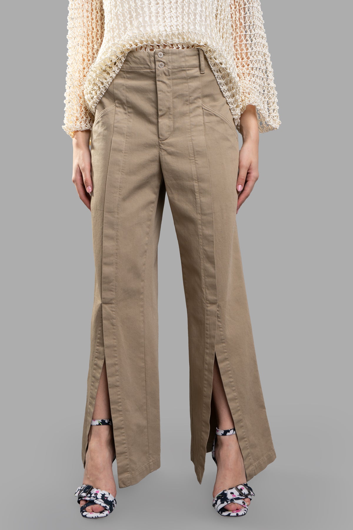Gentry Portofino Denim Palazzo Pants featuring a high-waisted design, side slits, and pockets, styled with a light top.
