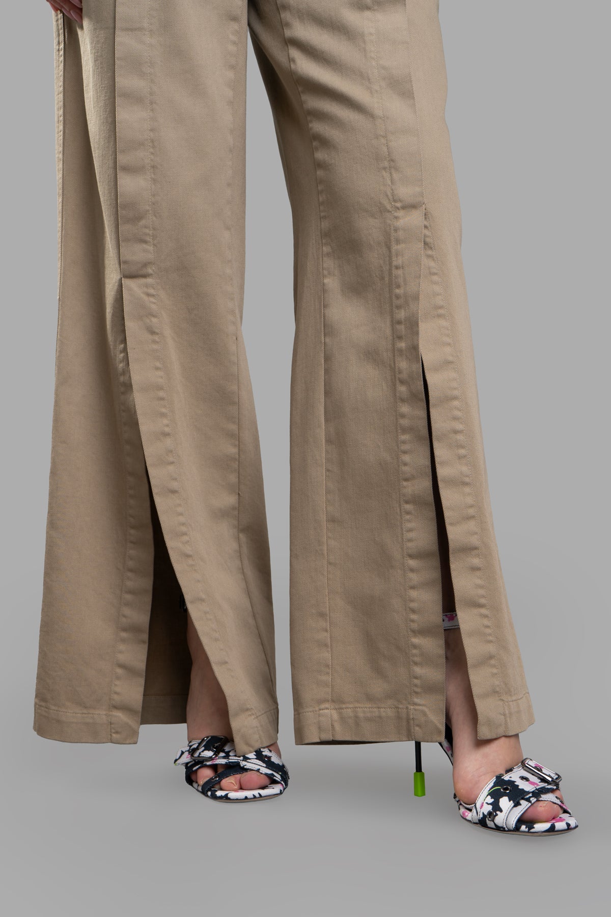 Gentry Portofino Denim Palazzo Pants feature elegant front slits and high waist design in beige, showcasing a chic look.