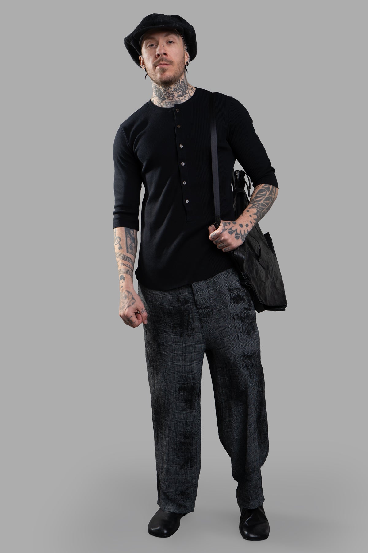 Marc Point Low Crotch Trousers in grey linen, front view on model, abstract pattern, relaxed fit, raw-cut edges.