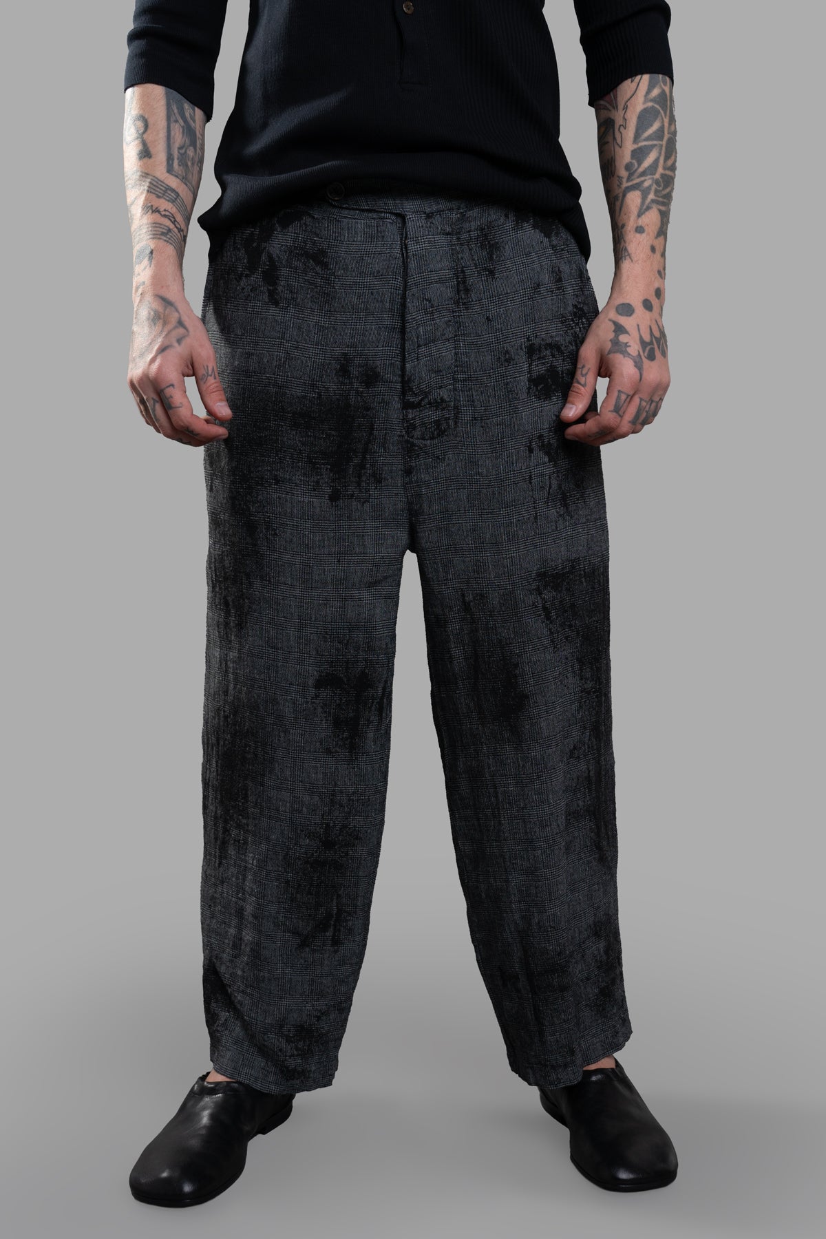 Marc Point Low Crotch Trousers in grey linen, featuring a relaxed fit, abstract pattern, and raw-cut edges, styled on model.