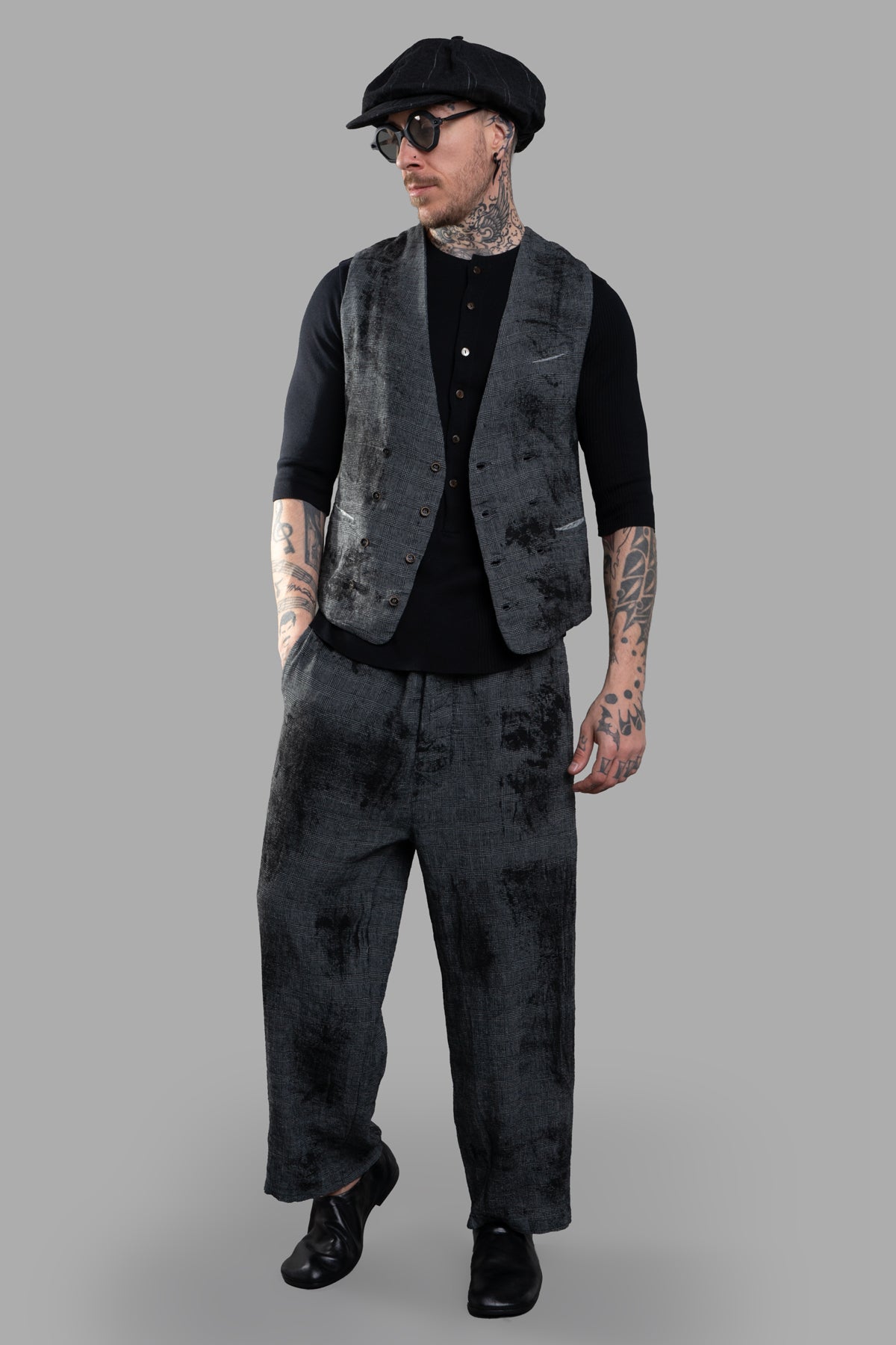 Marc Point Double-breasted Vest in grey, front view on model, featuring chic abstract pattern with black shirt and cap.