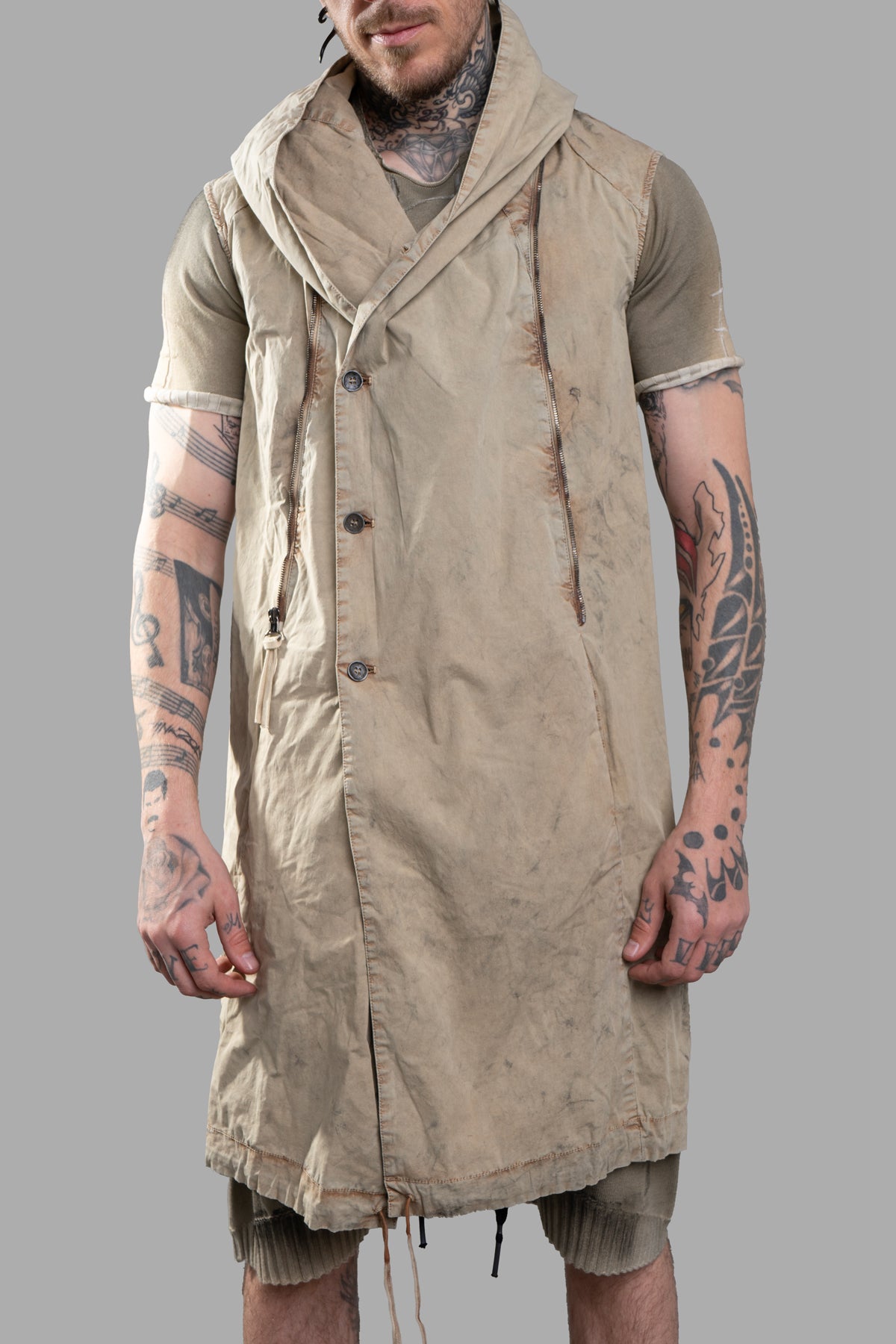 Masnada Transformative Linen Parka features raised seam detail, shown worn open with a cozy draped collar in beige linen.